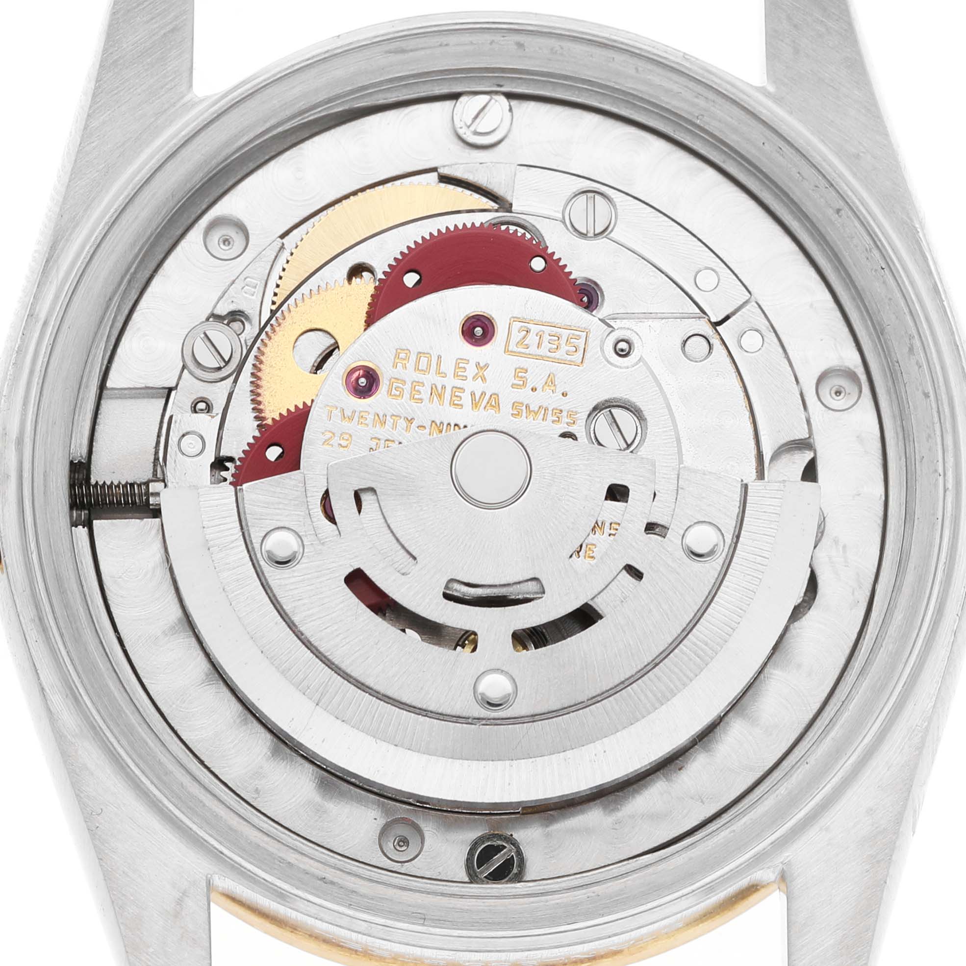The image shows a top view of the Rolex Mid-Size 68273 Women's Steel and Gold (two tone) White Dial watch's movement, revealing gears and the rotor mechanism.