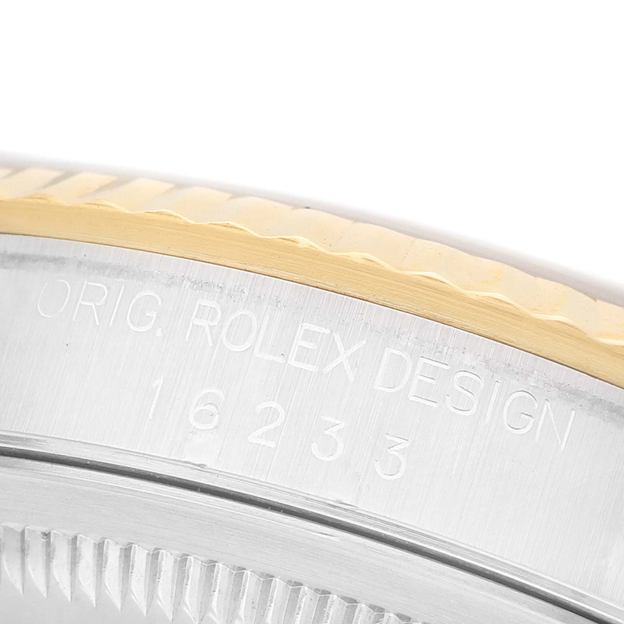 The image shows a close-up of the Rolex Datejust 16233 Men's Steel and Gold (two tone) Champagne Dial's outer bezel and case edge, featuring the model number engraving.