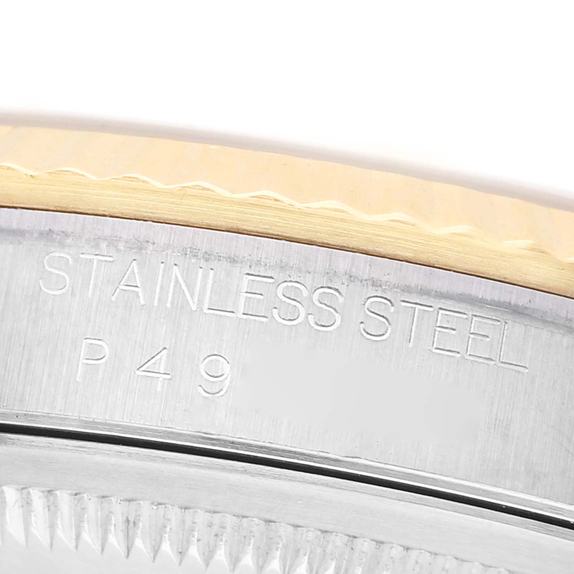 The image shows a close-up of the side of a Rolex Datejust 16233 Men's Steel and Gold (two tone) Champagne Dial watch, highlighting the "STAINLESS STEEL" engraving.