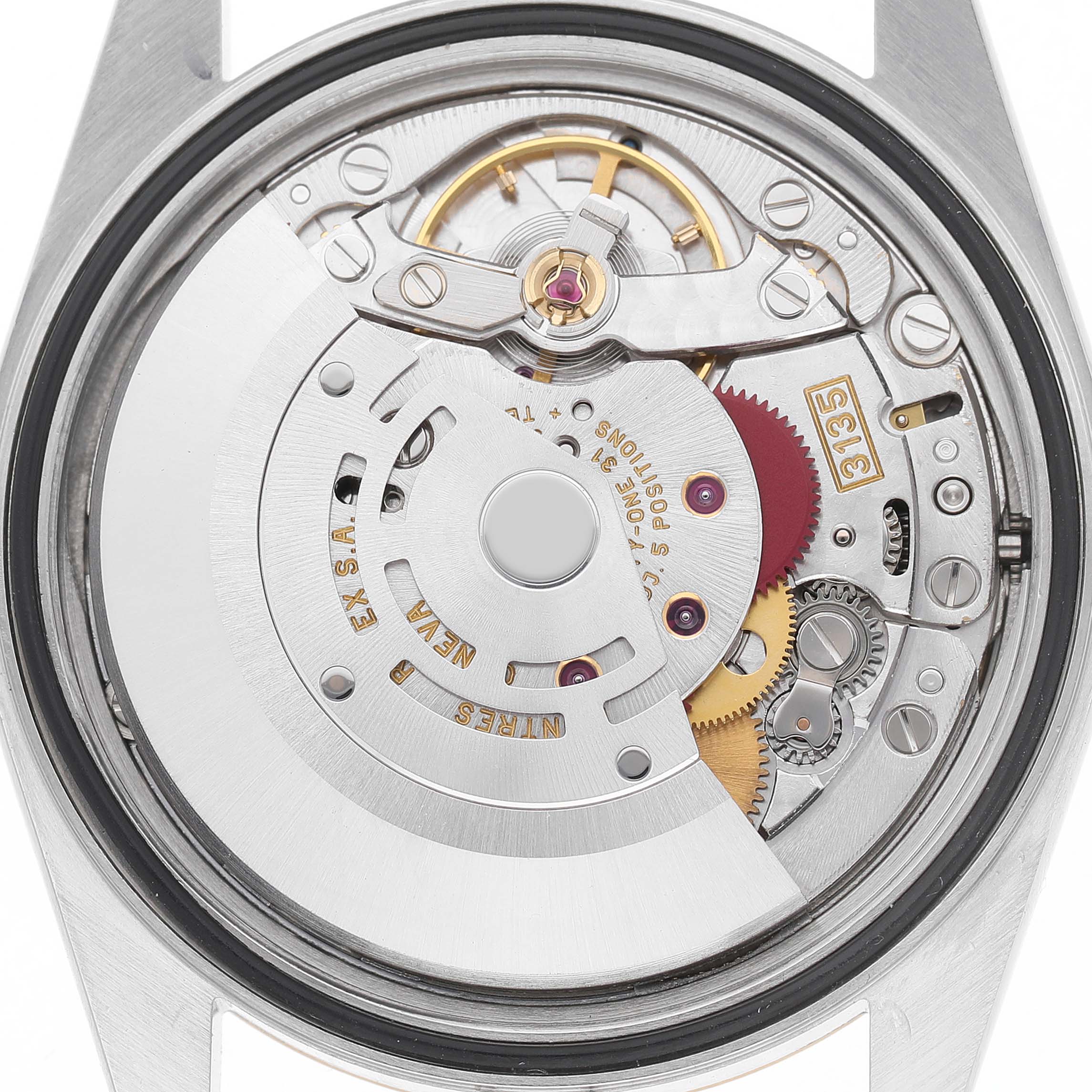 The image shows the movement mechanism of a Rolex Datejust 16233 Men's Steel and Gold (two tone) Champagne Dial watch, viewed from the back, displaying its intricate parts.