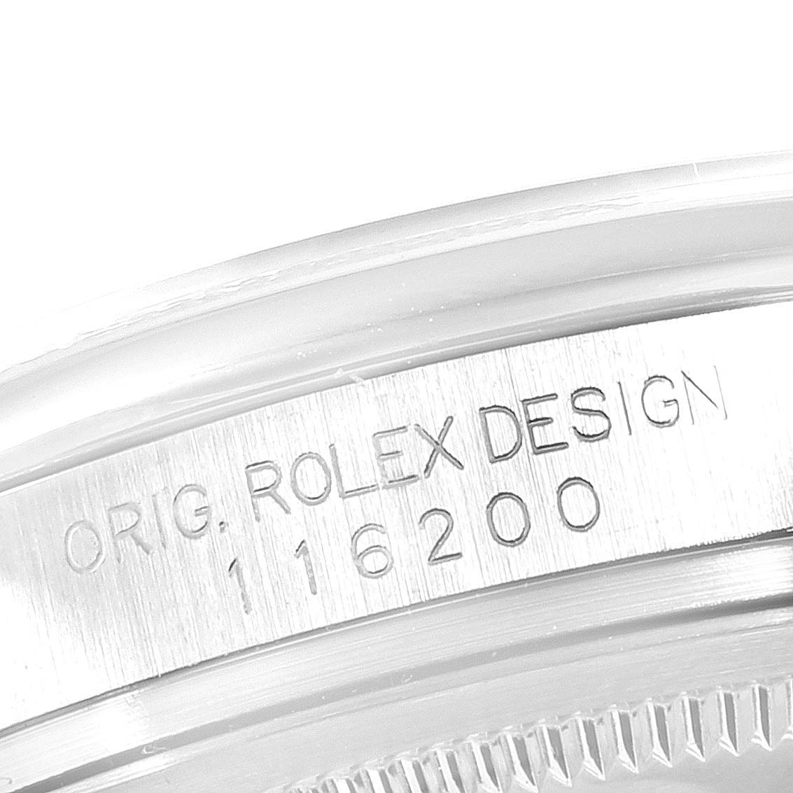 This image shows an angled close-up of the case side, focusing on the engravings of a Rolex Datejust 116200 Men's Stainless Steel White Dial 116200 Men's Stainless Steel White Dial model.