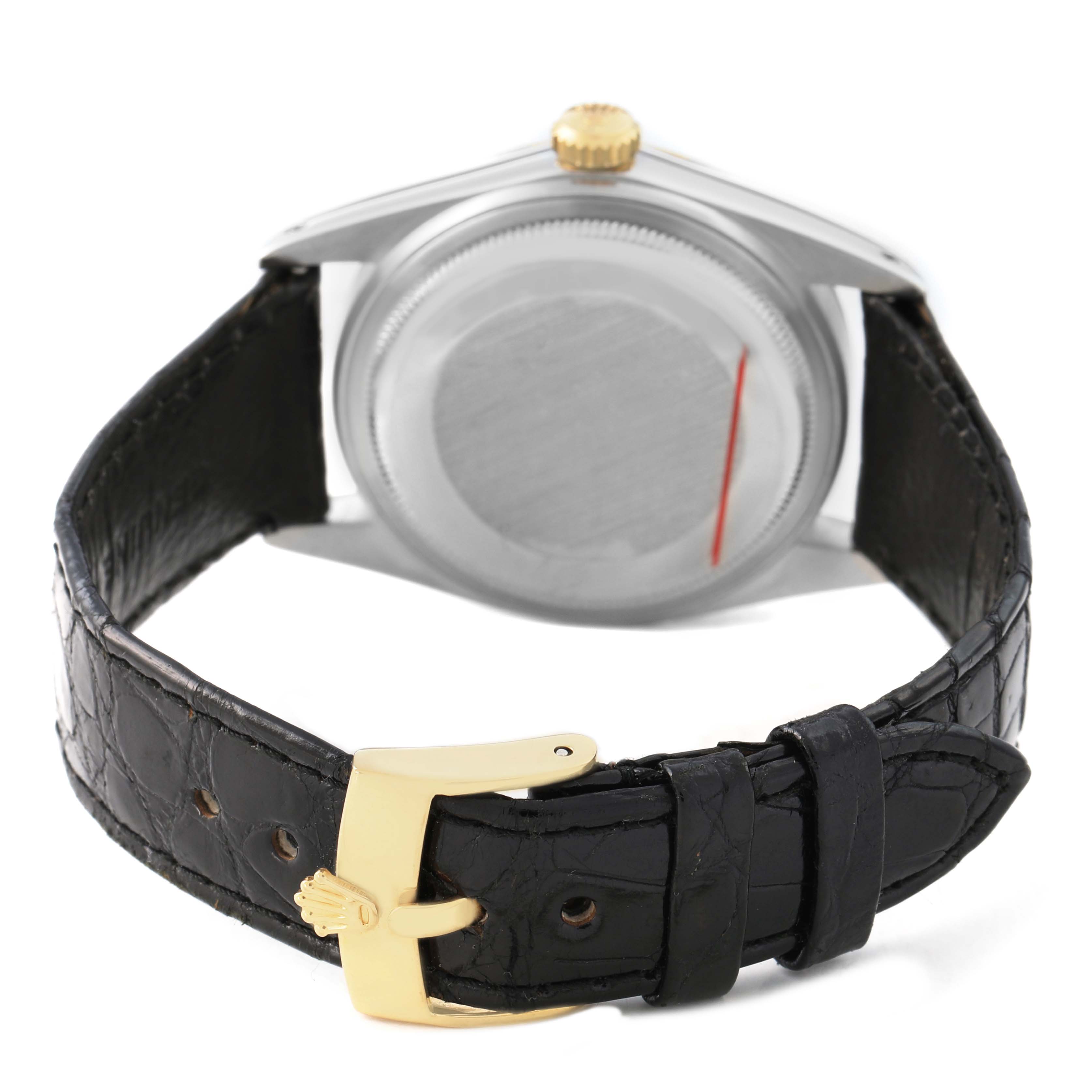 The Rolex Datejust 16013 Men's Steel and Gold (two tone) White Dial watch is shown from the back, highlighting its case back, gold crown, and black leather strap with a gold buckle.