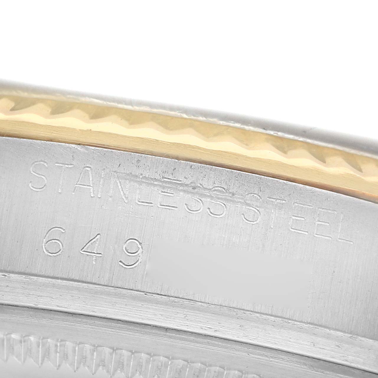 The image shows a close-up of the Rolex Datejust 16013 Men's Steel and Gold (two tone) White Dial's case side, highlighting the stainless steel and engravings.