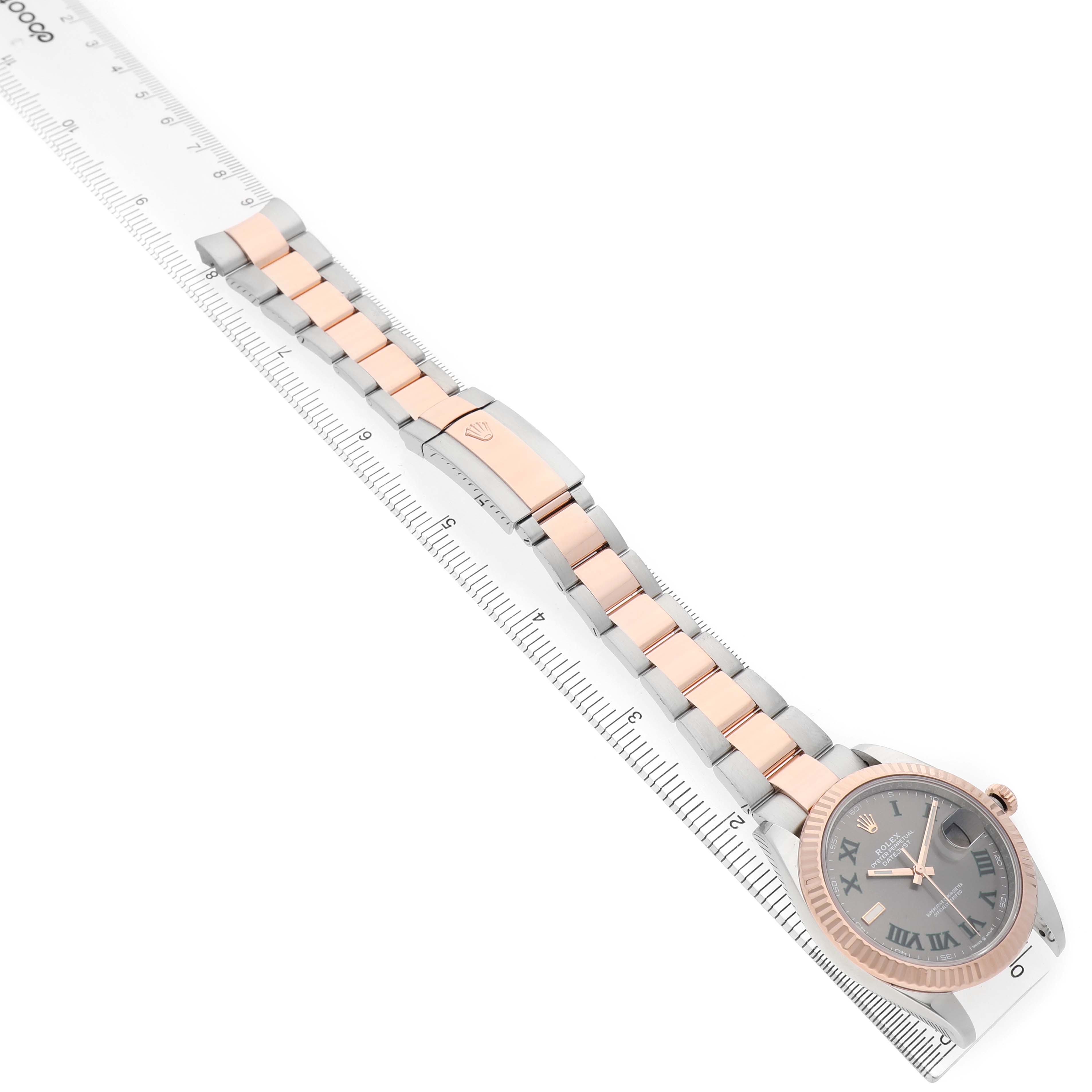 The Rolex Datejust 41 126331 Men's Steel and Gold (two tone) Grey Dial is shown from an overhead angle, displaying the full bracelet and watch face with a fluted bezel.