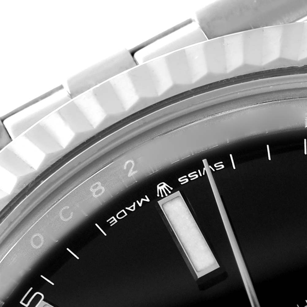The image shows a close-up of the bezel, part of the dial, and part of the bracelet of the Rolex Datejust 41 126334 Men
s Stainless Steel Black Dial 126334 Men
s Stainless Steel Black Dial watch.