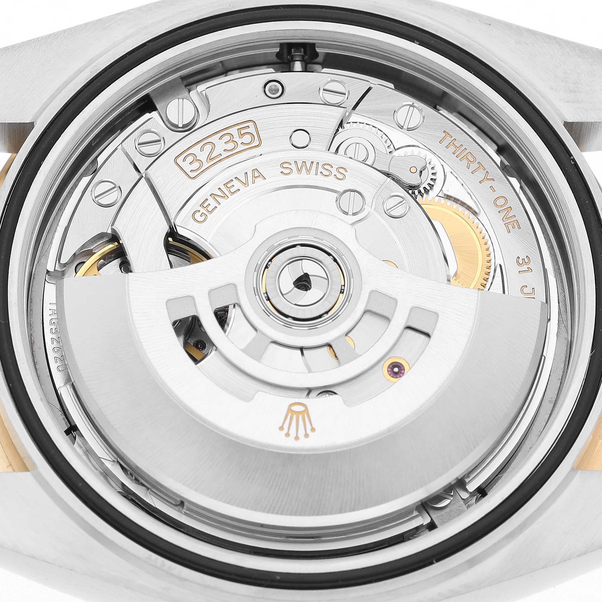The image shows the movement of a Rolex Datejust 41 126333 Men's Steel and Gold (two tone) Grey Dial, focusing on its intricate mechanical parts from a back angle.
