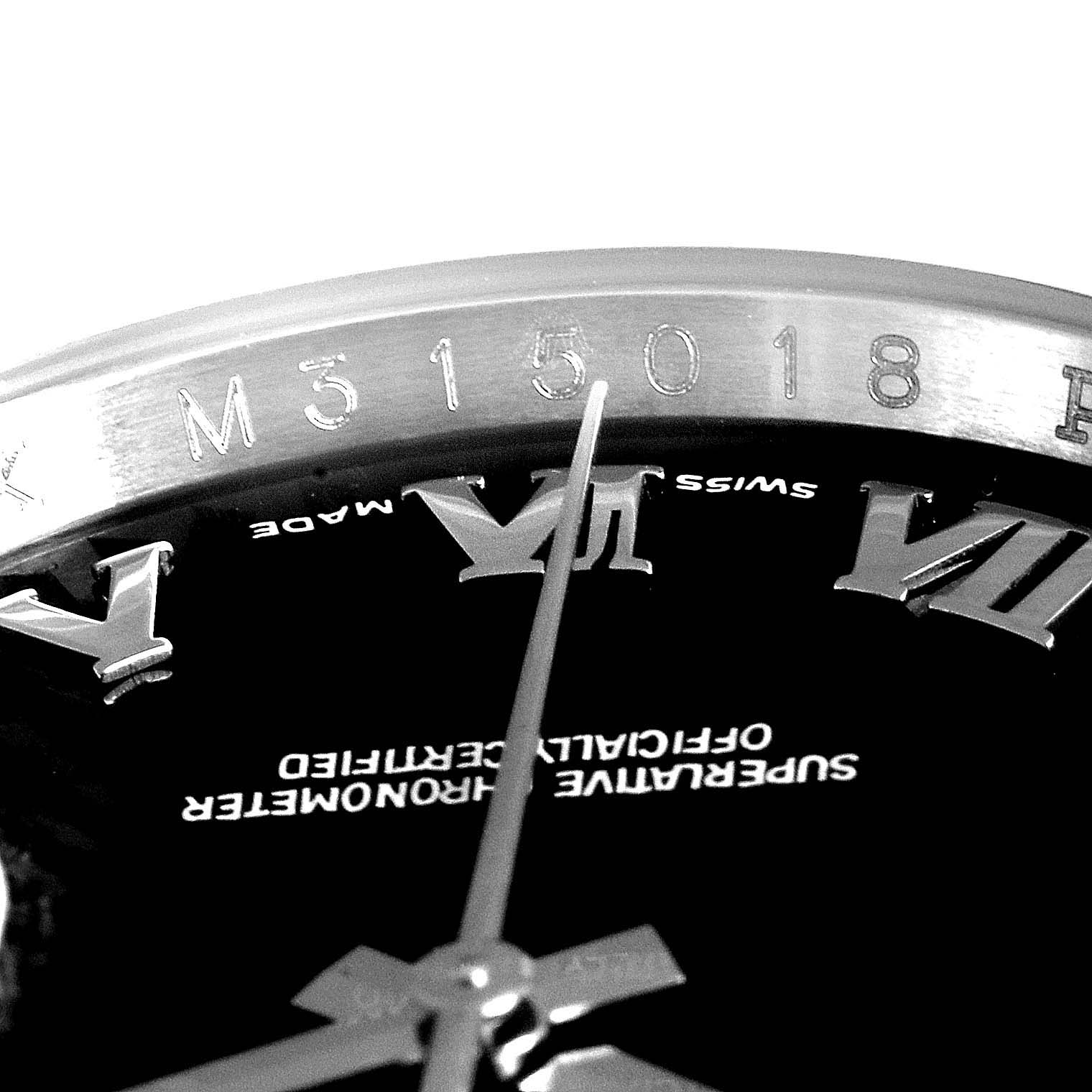 Close-up of the Rolex Datejust 116200 Men's Stainless Steel Black Dial 116200 Men's Stainless Steel Black Dial watch showing the dial with Roman numerals and part of the serial number on the bezel.