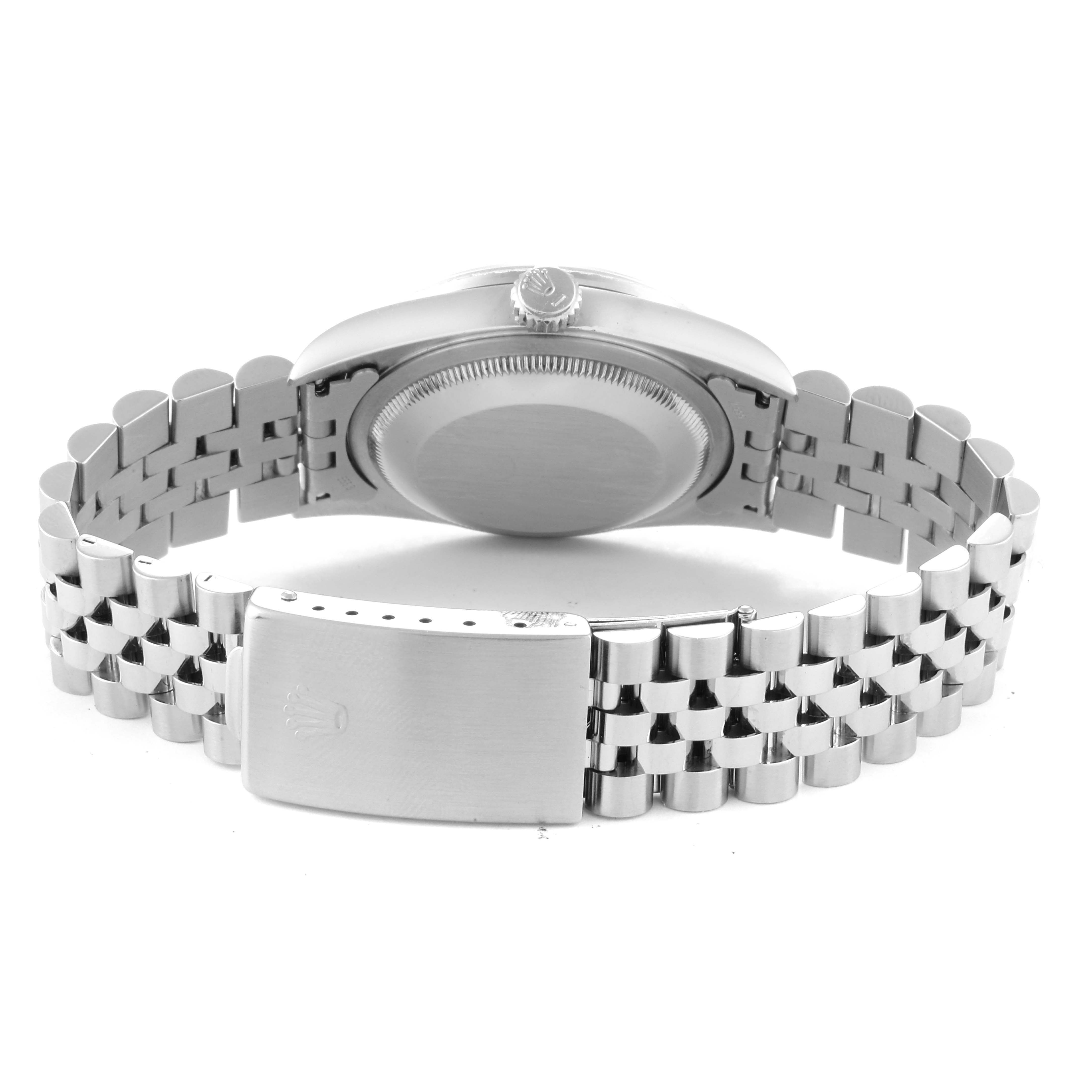 The image shows the back view of a Rolex Datejust 16220 Men's Stainless Steel Blue Dial 16220 Men's Stainless Steel Blue Dial watch, highlighting the case back, crown, and bracelet clasp.