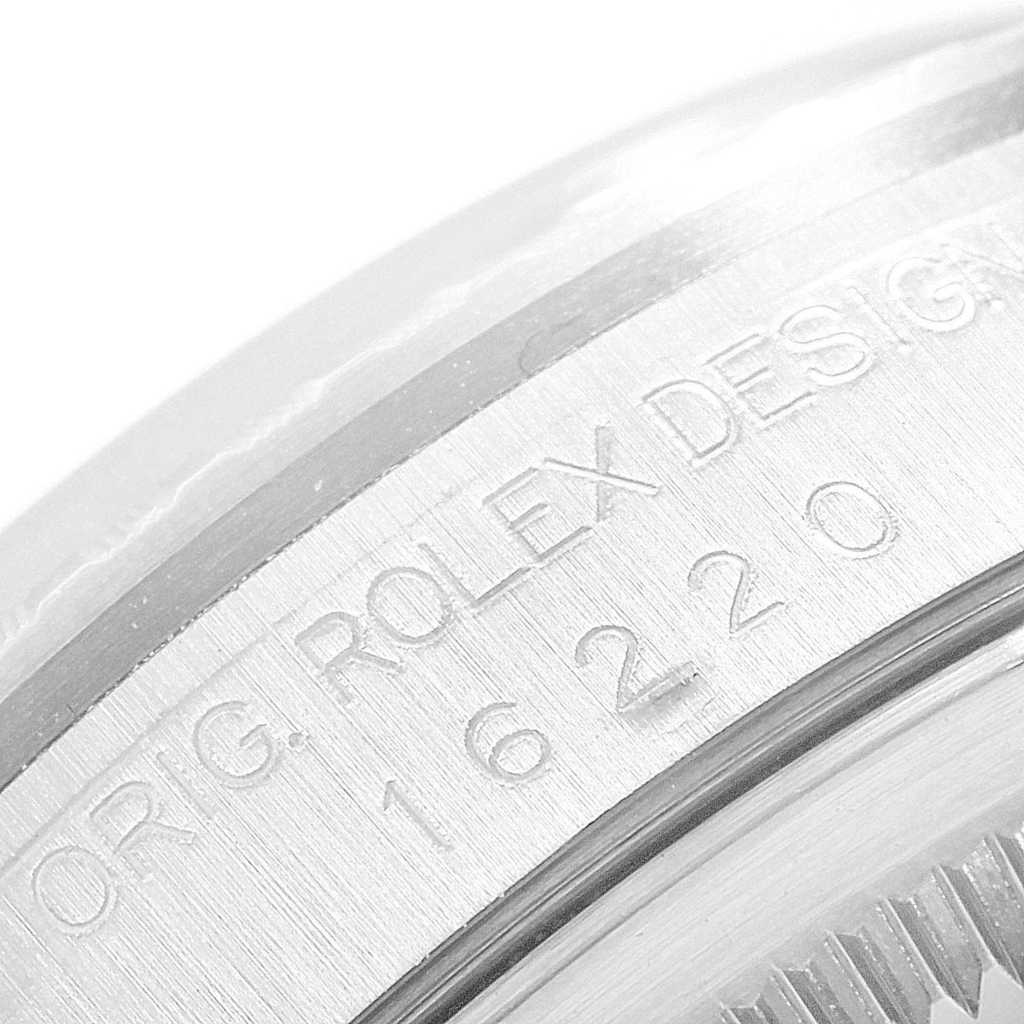 This image shows a close-up of the engraved case side of a Rolex Datejust 16220 Men's Stainless Steel Blue Dial 16220 Men's Stainless Steel Blue Dial, including the model number 16220.