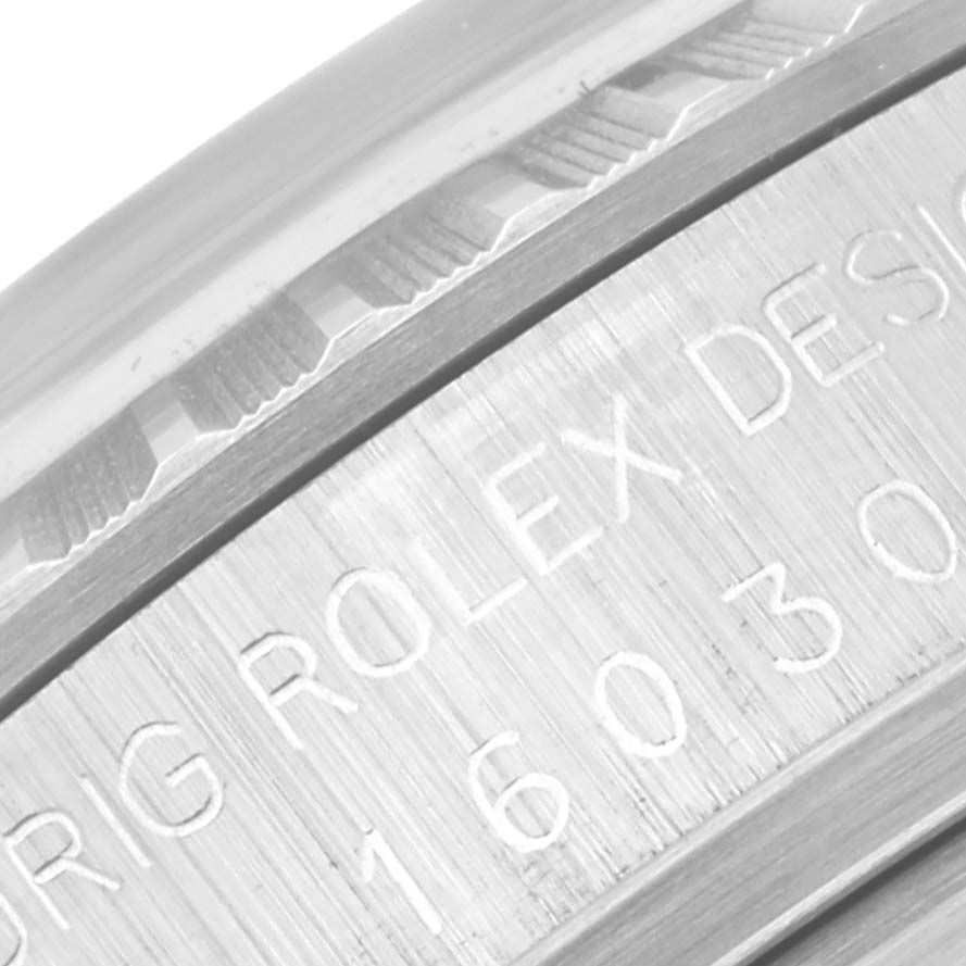 The image shows a close-up view of the engraved details on the Rolex Vintage Collection 16030 Men
s Stainless Steel Silver Dial 16030 Men
s Stainless Steel Silver Dial model
s case.