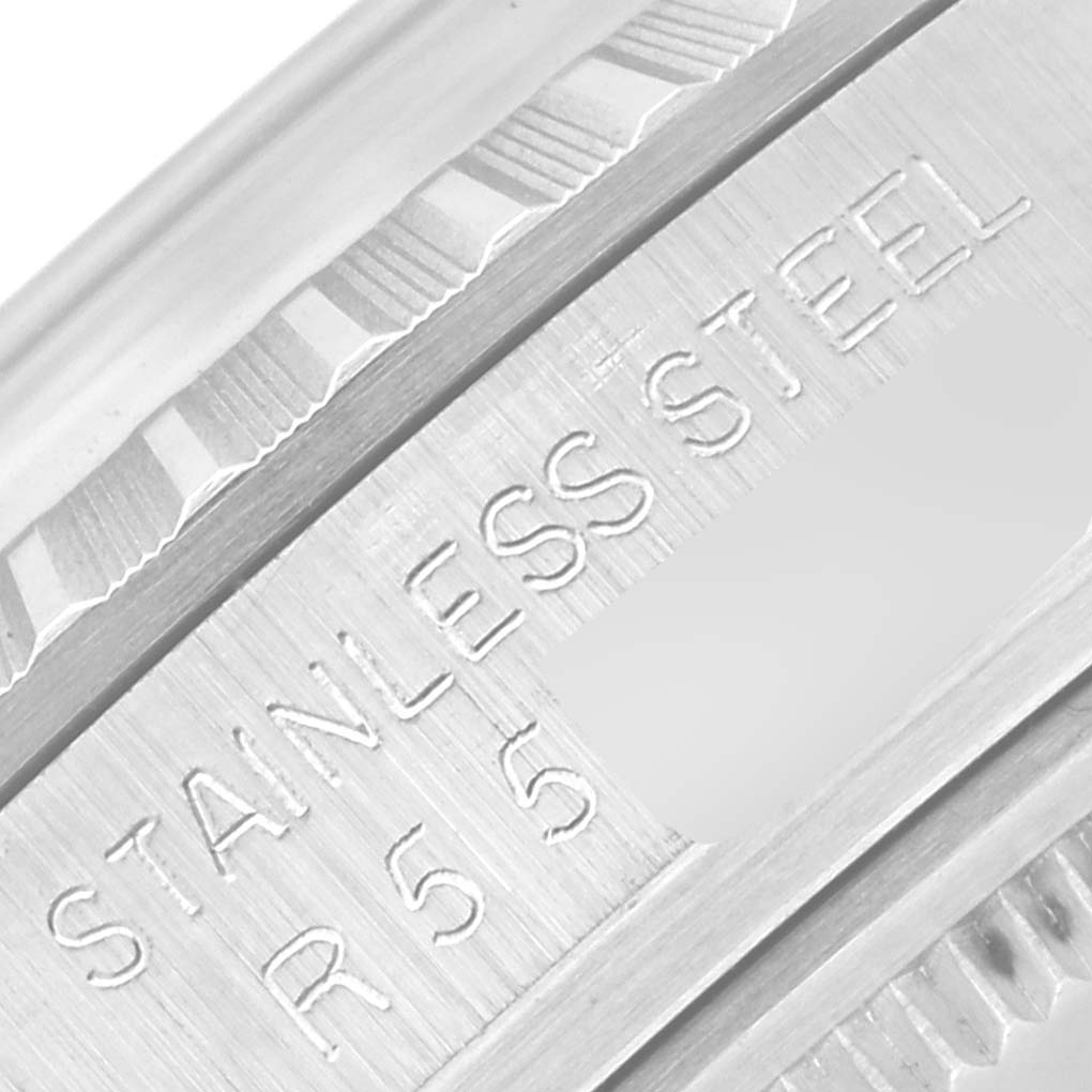 This close-up image shows the engraving of "STAINLESS STEEL" and a partial reference number on the side of a Rolex Vintage Collection 16030 Men
s Stainless Steel Silver Dial 16030 Men
s Stainless Steel Silver Dial watch.