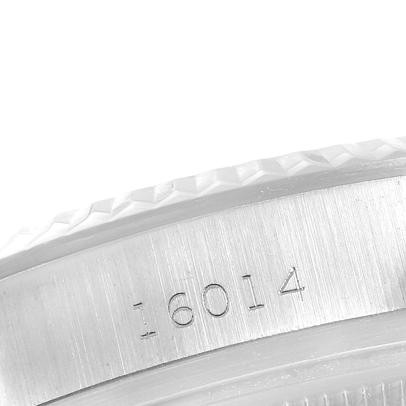 This image shows a close-up of the engraved reference number on the side of a Rolex Vintage Collection 16014 Men
s Stainless Steel Silver Dial 16014 Men
s Stainless Steel Silver Dial model.