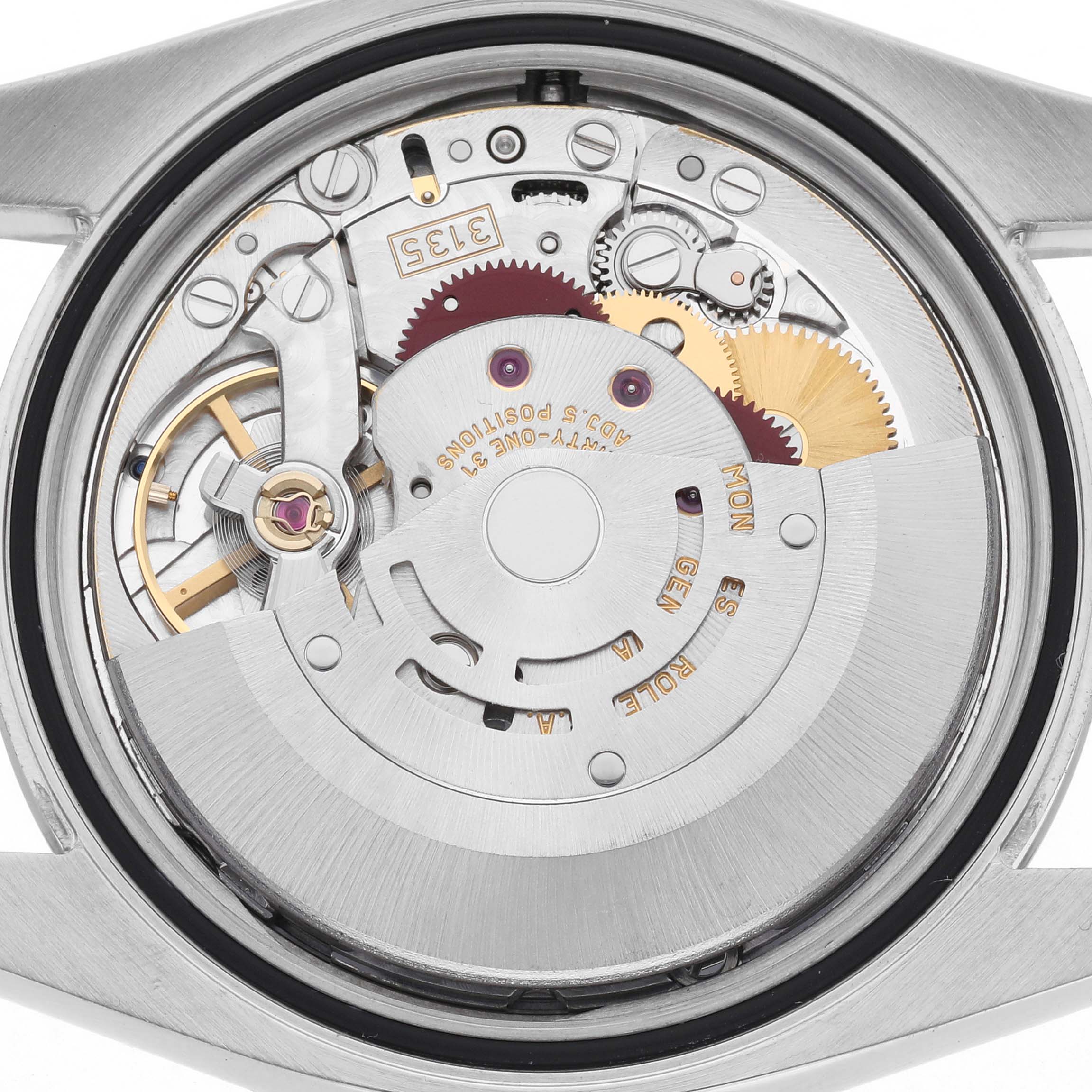 The image shows the movement of a Rolex Datejust 116200 Men
s Stainless Steel Silver Dial 116200 Men
s Stainless Steel Silver Dial watch from the back, highlighting internal gears and components.
