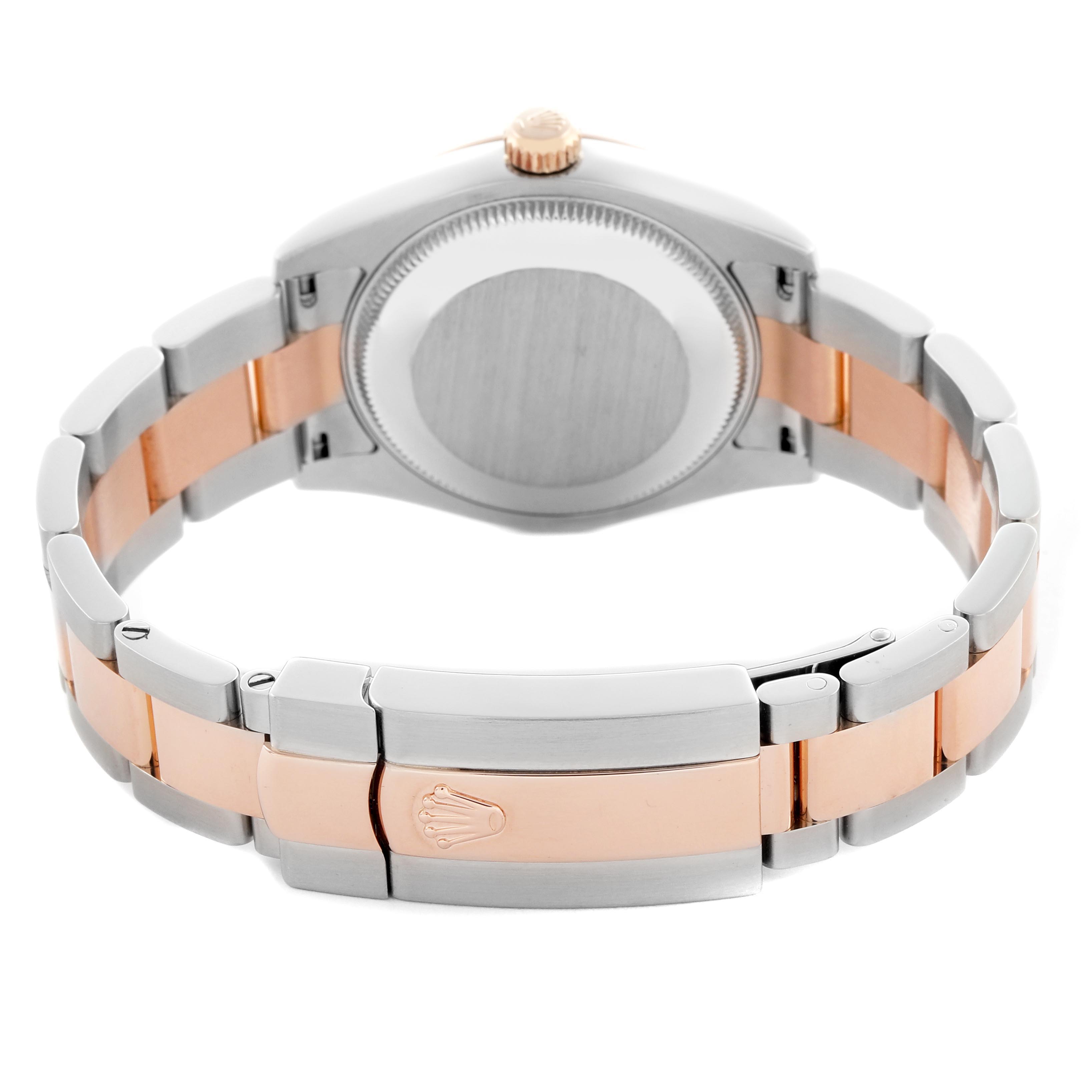 The image shows the back and bracelet of a mid-size Rolex watch, highlighting its clasp and two-tone metal design.