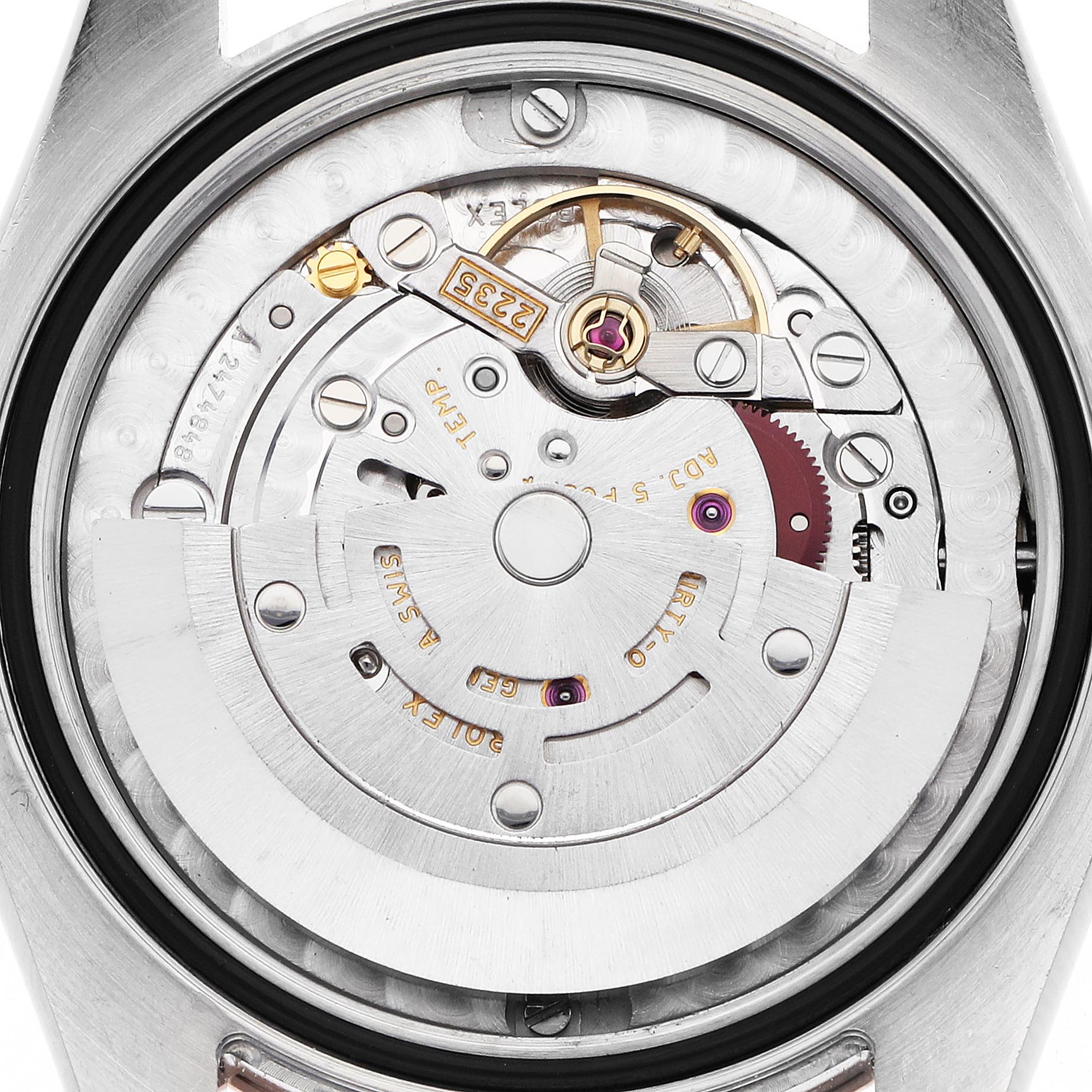 The image shows a close-up of the movement mechanism of a Mid-Size Rolex watch from the back.