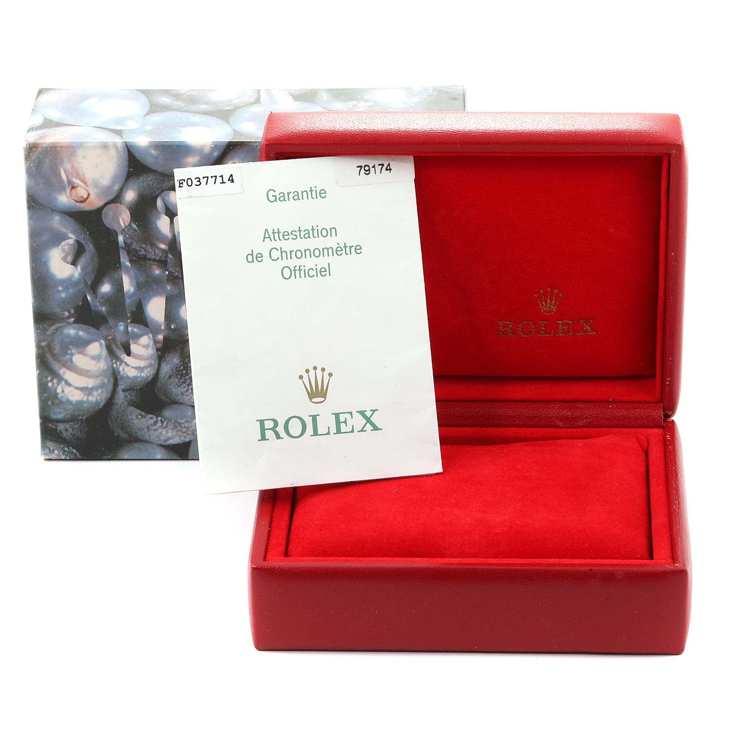 The image shows the box and warranty card of the Rolex Datejust 79174 Women
s Stainless Steel Pink Dial 79174 Women
s Stainless Steel Pink Dial watch model.