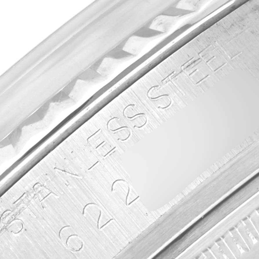 This close-up image shows the engraving detail on the stainless steel bezel of a Vintage Collection Rolex watch.