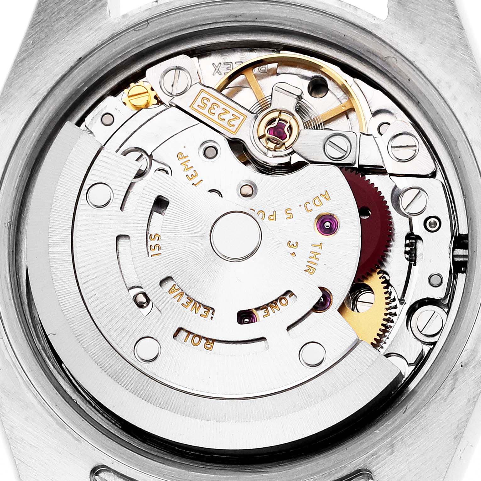 The image shows a close-up view of the Rolex Datejust 179173 Women's Steel and Gold (two tone) Champagne Dial 179173 Women's Steel and Gold (two tone) Champagne Dial's movement, highlighting gears and the rotor.