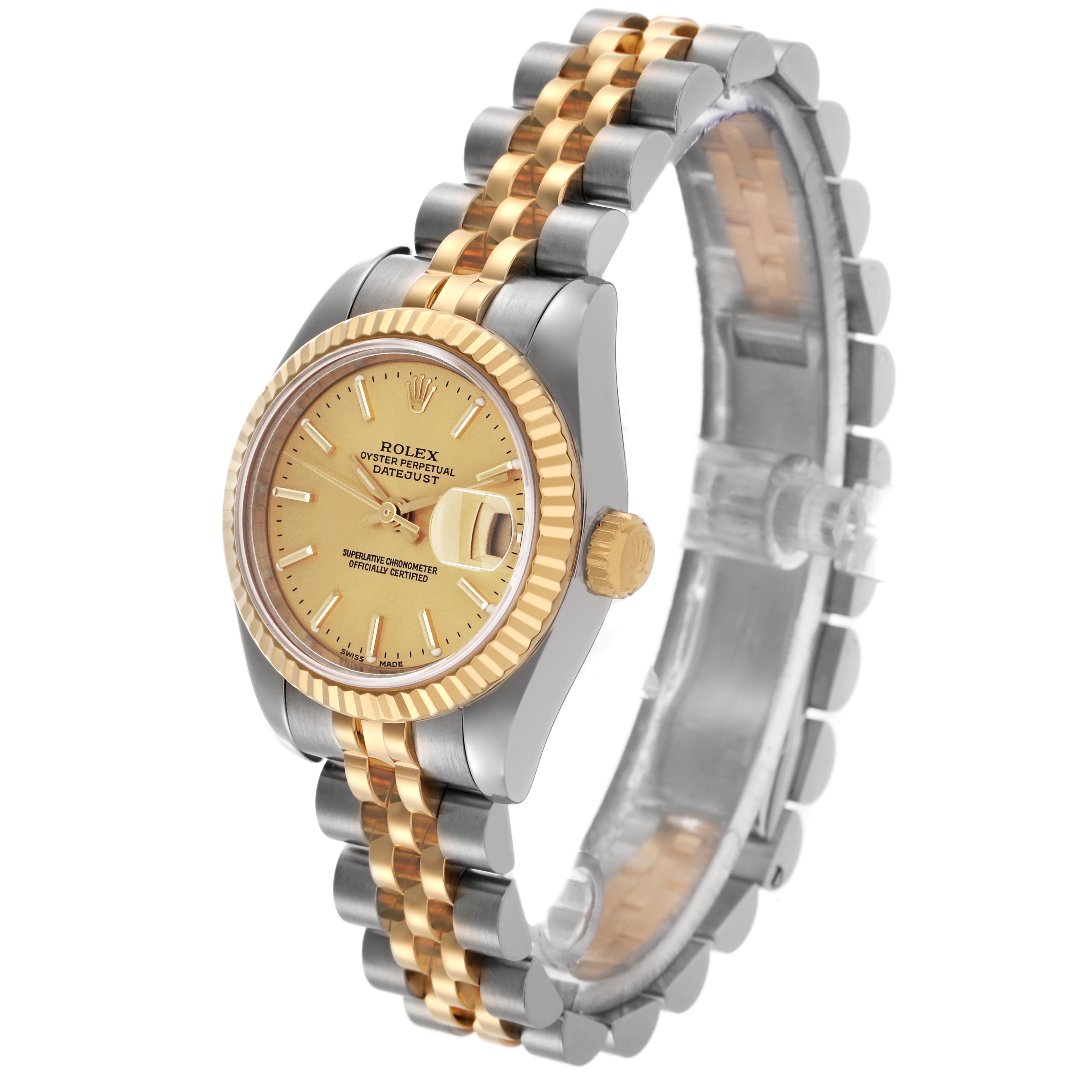 The image shows a Rolex Datejust 179173 Women's Steel and Gold (two tone) Champagne Dial 179173 Women's Steel and Gold (two tone) Champagne Dial watch at an oblique angle, highlighting the dial, bezel, crown, and bracelet.