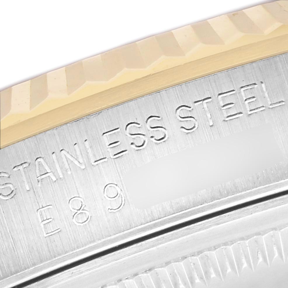 The image shows a close-up of the Rolex Datejust 16233 Men's Steel and Gold (two tone) Beige Dial 16233 Men's Steel and Gold (two tone) Beige Dial watch, highlighting the stainless steel engraved part and fluted bezel.