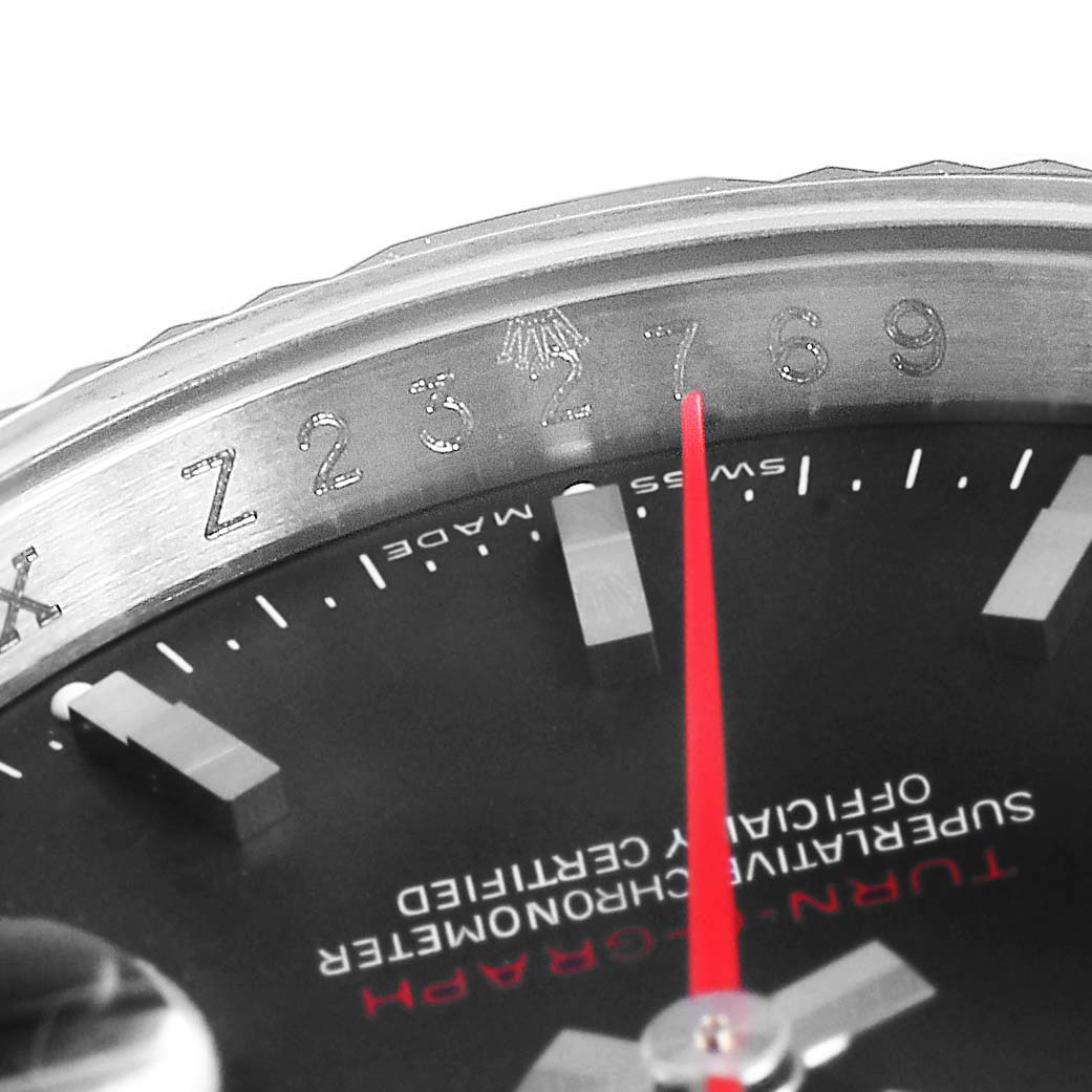 The image shows a close-up of the Rolex Turn-o-Graph 116264 Men
s Stainless Steel Black Dial 116264 Men
s Stainless Steel Black Dial watch, highlighting its bezel, dial, and red second hand.
