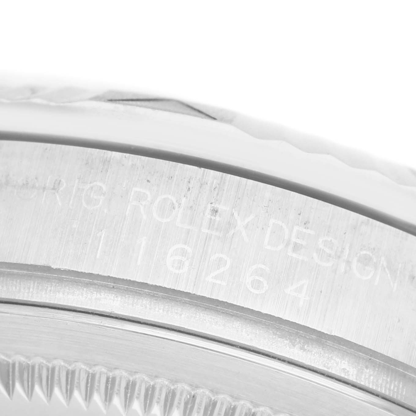 The image shows a close-up of the engraved bezel side of a Rolex Turn-o-Graph 116264 Men's Stainless Steel Blue Dial watch.
