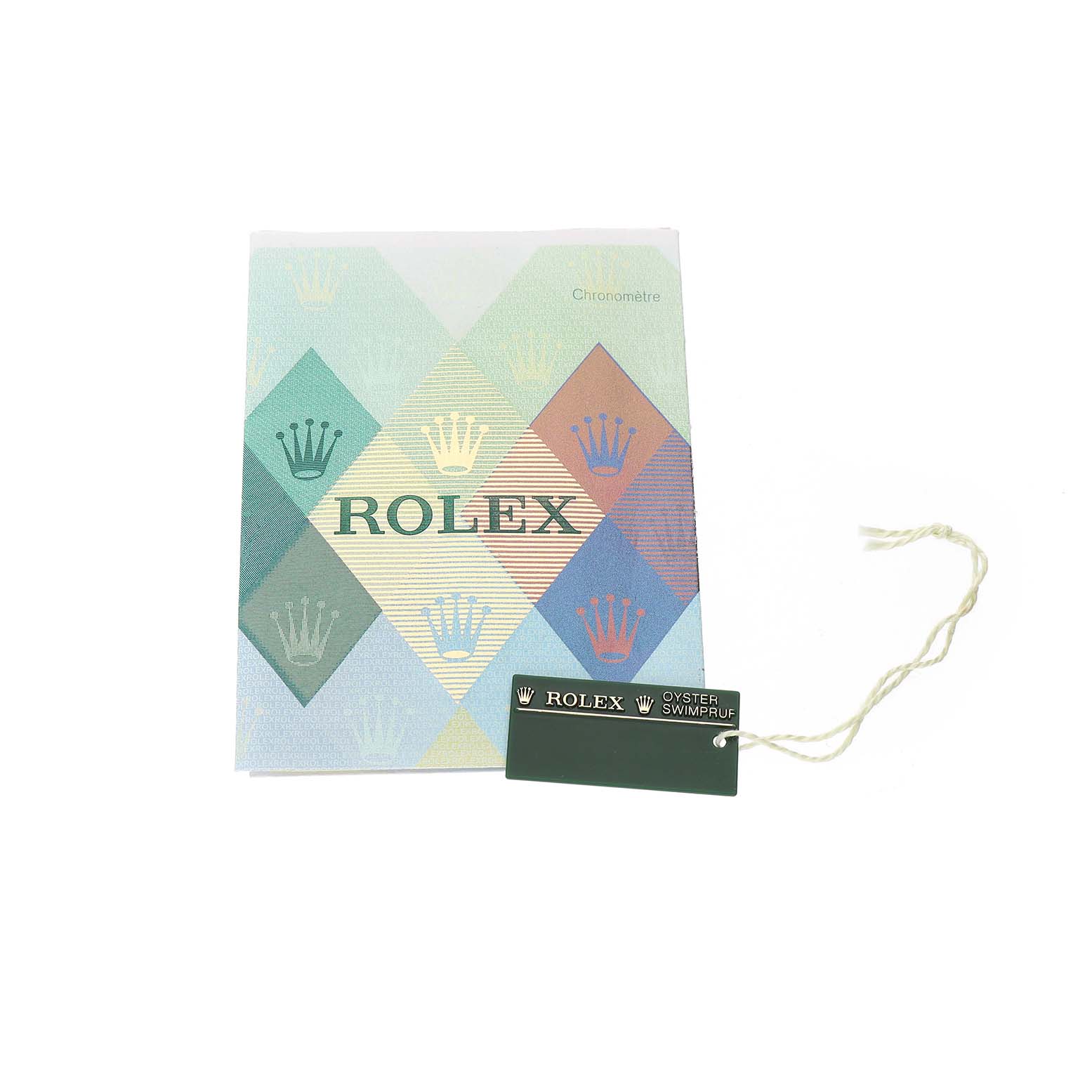 The image shows a Rolex booklet with a tag attached, likely for a Turn-o-Graph model, featuring the brand name and logo.