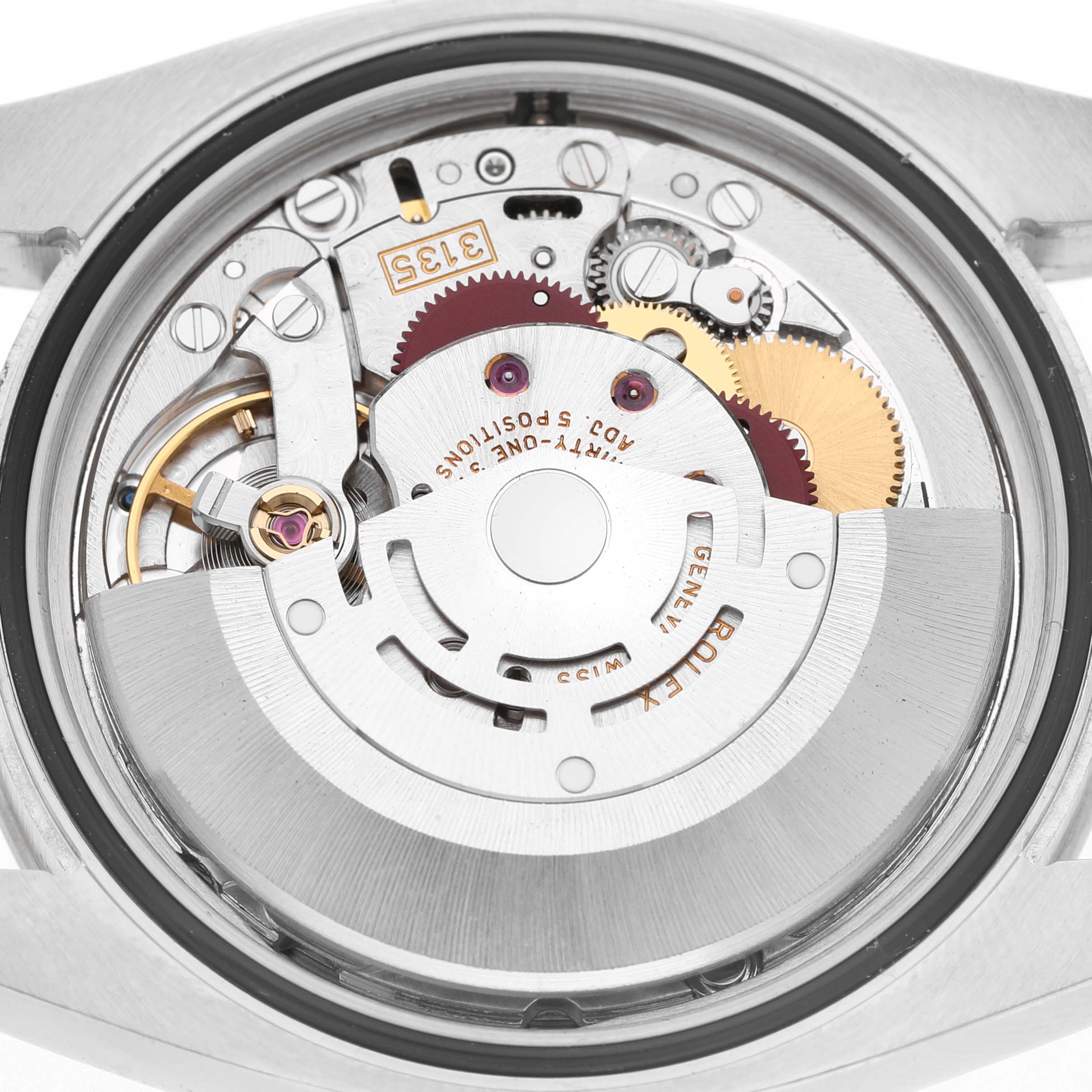 The image shows the movement of a Rolex Turn-o-Graph 116264 Men's Stainless Steel Blue Dial watch viewed from the back, highlighting its internal components.