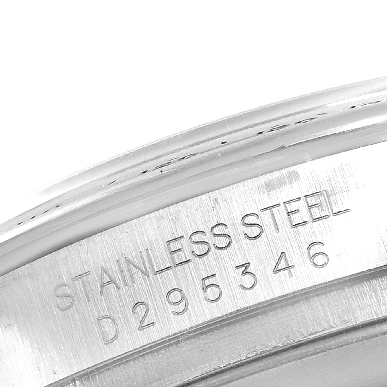 This close-up image shows the side engraving on the stainless steel casing of a Rolex Daytona 116520 Men's Stainless Steel Black Dial 116520 Men's Stainless Steel Black Dial watch.
