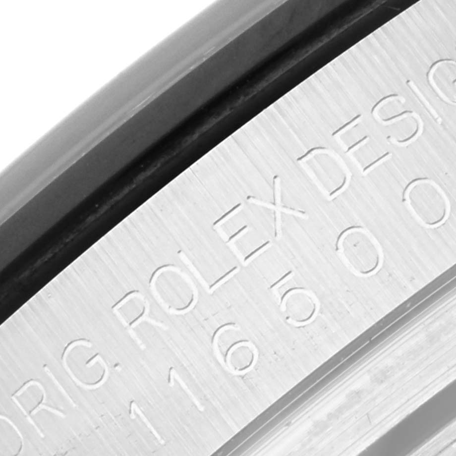 The image shows a close-up of the engraved text on the side of the case of a Rolex Daytona 116500LN Men's Stainless Steel White Dial 116500LN Men's Stainless Steel White Dial watch.