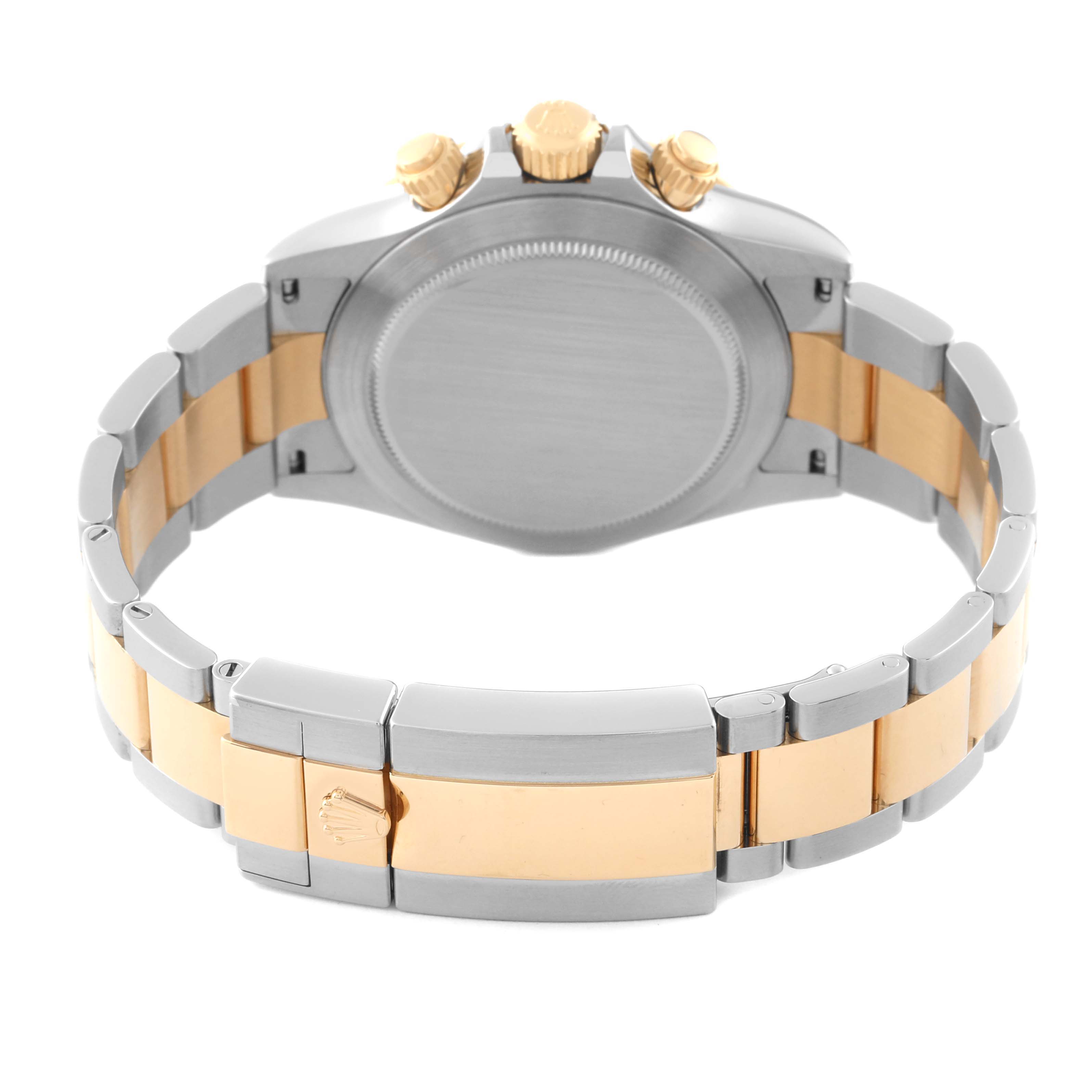 The image shows the back and clasp of a Rolex Daytona 116503 Men's Steel and Gold (two tone) Champagne Dial 116503 Men's Steel and Gold (two tone) Champagne Dial watch, highlighting its bi-metal bracelet and pushers.