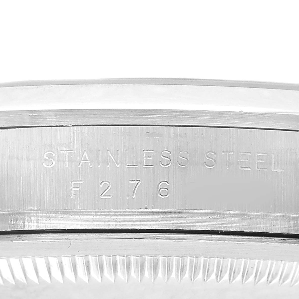 The image shows a close-up of the case side of the Rolex Explorer 114270 Men's Stainless Steel Black Dial, revealing the "STAINLESS STEEL" engraving.