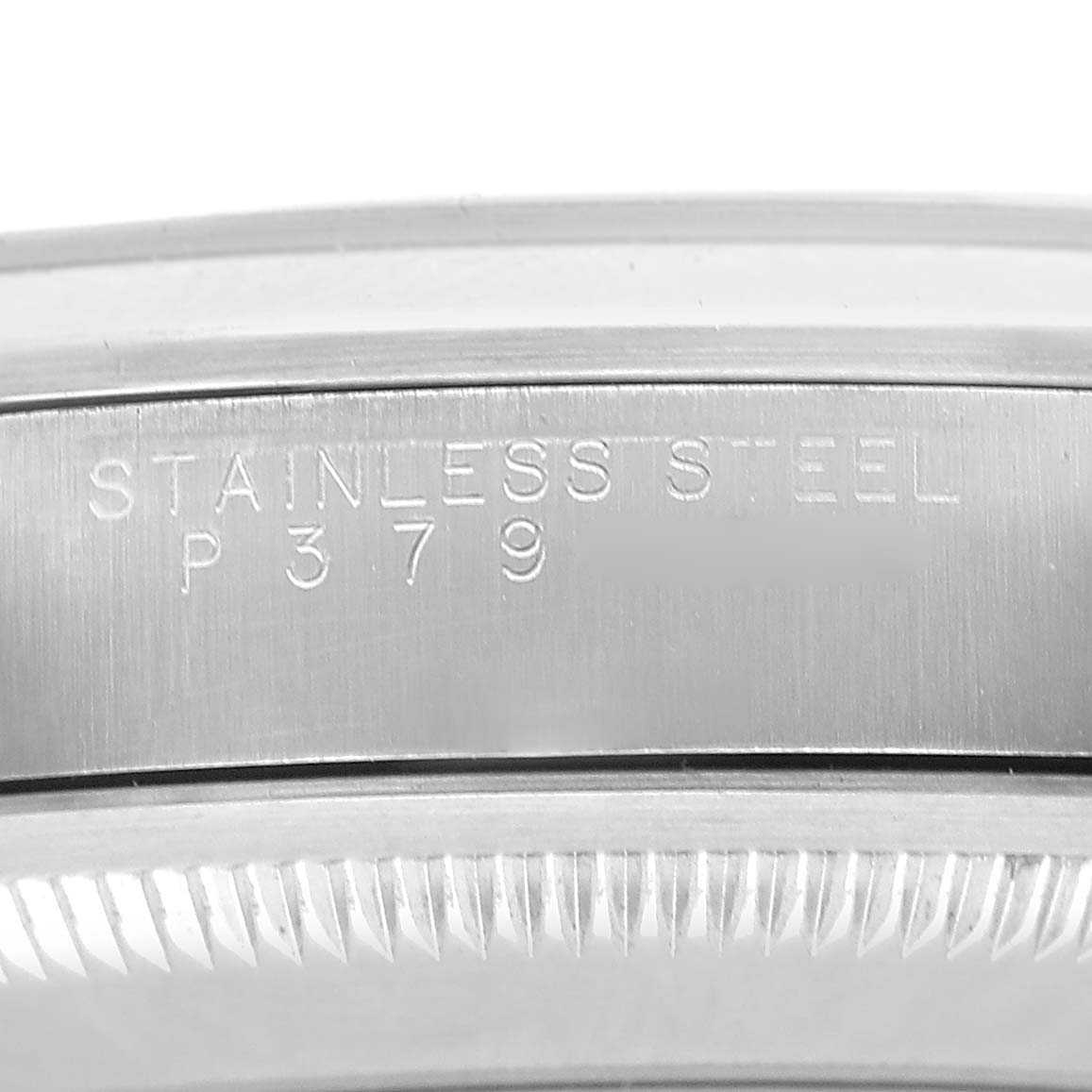 The image shows a close-up of the side of a Rolex Explorer 14270 Men's Stainless Steel Black Dial watch case with "Stainless Steel P379" engraved on it.