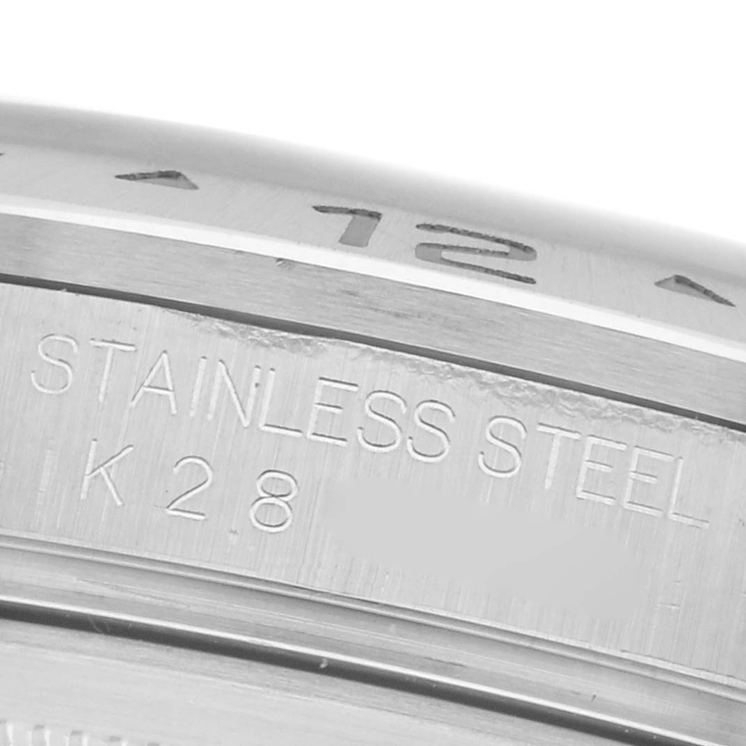 The image shows a close-up of the stainless steel casing and part of the bezel with markings on a Rolex Explorer 16570 Men's Stainless Steel Black Dial 16570 Men's Stainless Steel Black Dial watch.