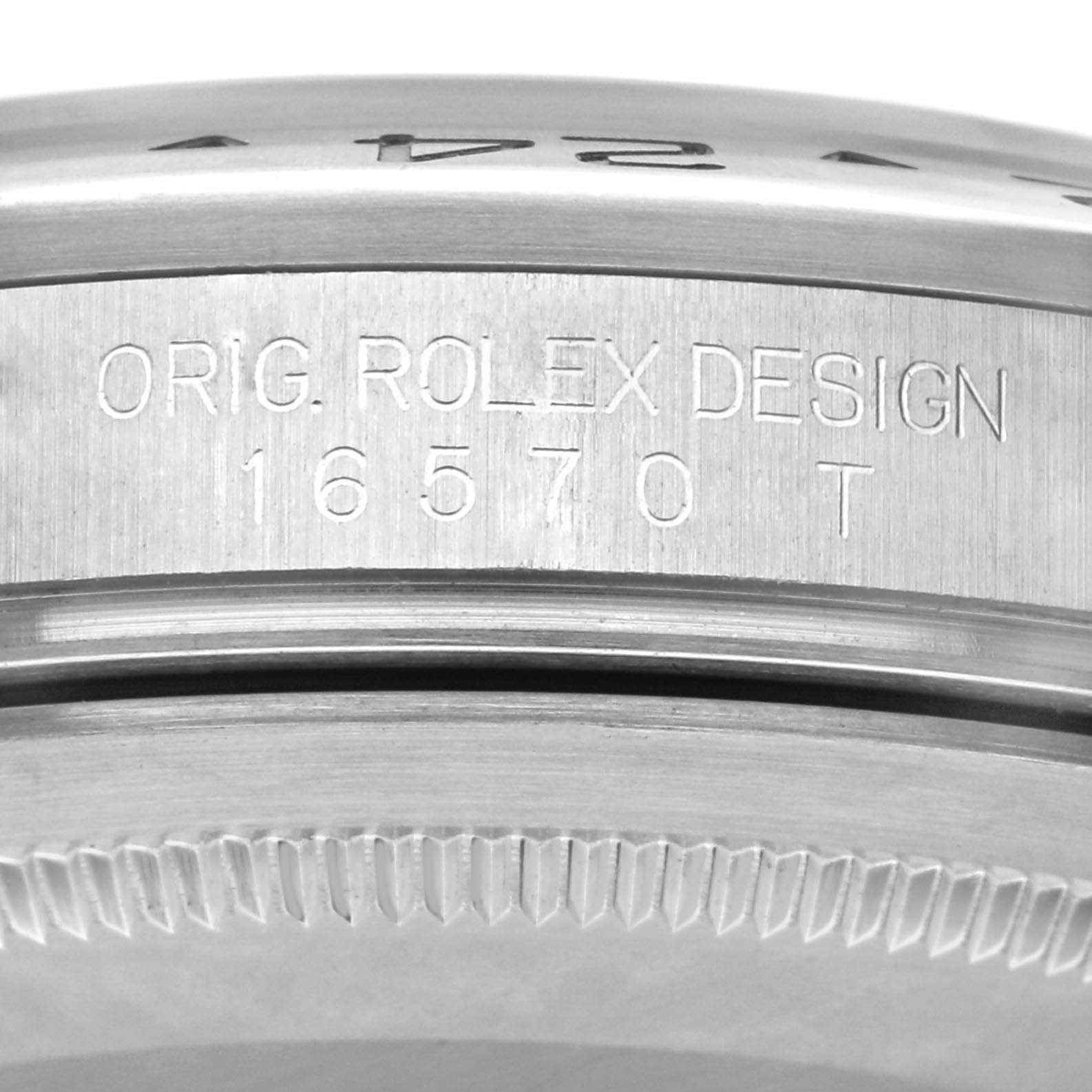 The image shows a close-up of the side engraving on a Rolex Explorer 16570 Men
s Stainless Steel Black Dial 16570 Men
s Stainless Steel Black Dial model, displaying "ORIG. ROLEX DESIGN 16570 T."