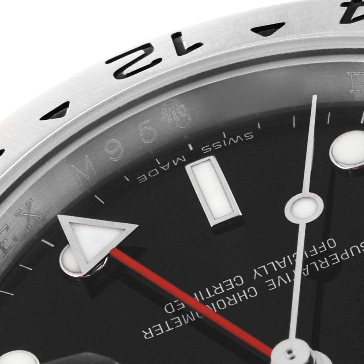 This close-up angle of the Rolex Explorer 16570 Men
s Stainless Steel Black Dial 16570 Men
s Stainless Steel Black Dial watch shows part of the dial, bezel, hands, and the "Swiss Made" marking.