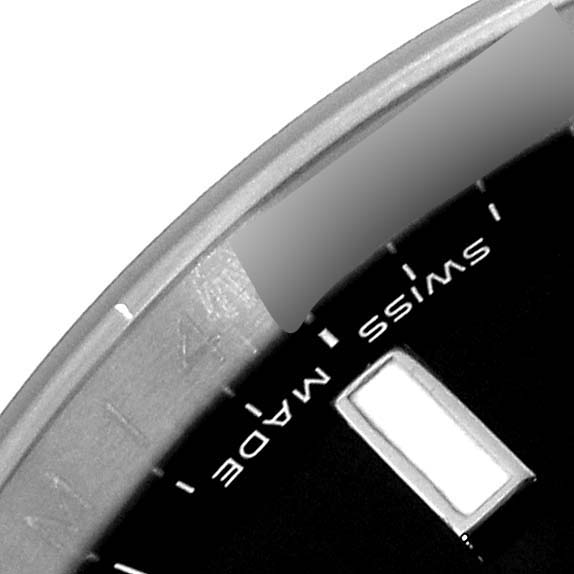 The image shows a close-up of the dial and bezel of a Rolex Explorer 16570T Men
s Stainless Steel Black Dial 16570T Men
s Stainless Steel Black Dial watch, highlighting the "Swiss Made" marking.