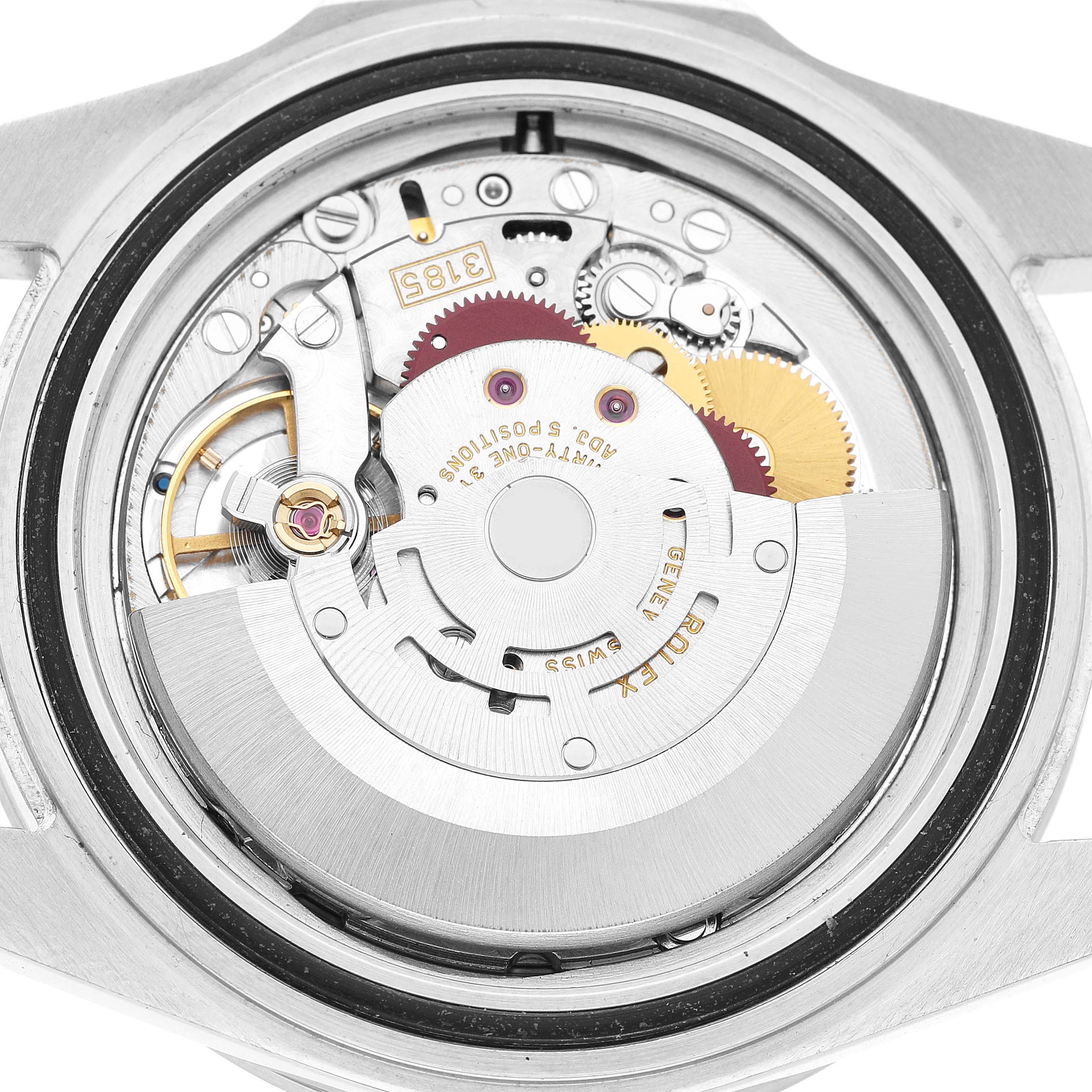 The image shows the internal movement of a Rolex Explorer 16570 Men's Stainless Steel White Dial watch from a back view, highlighting its intricate mechanical parts.
