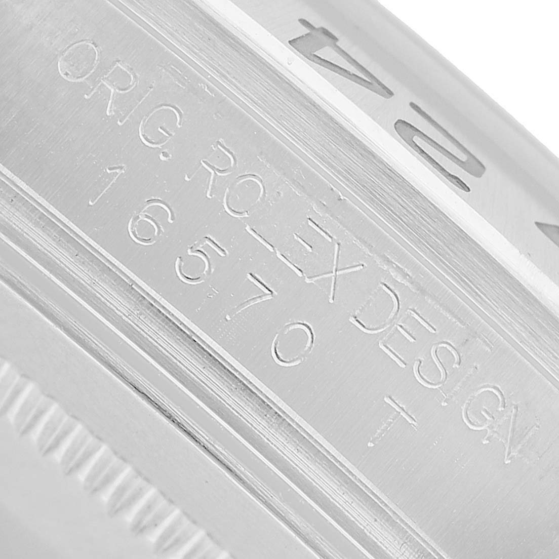 This image shows a close-up of the engraved case side of a Rolex Explorer 16570 Men's Stainless Steel White Dial, highlighting model number details.