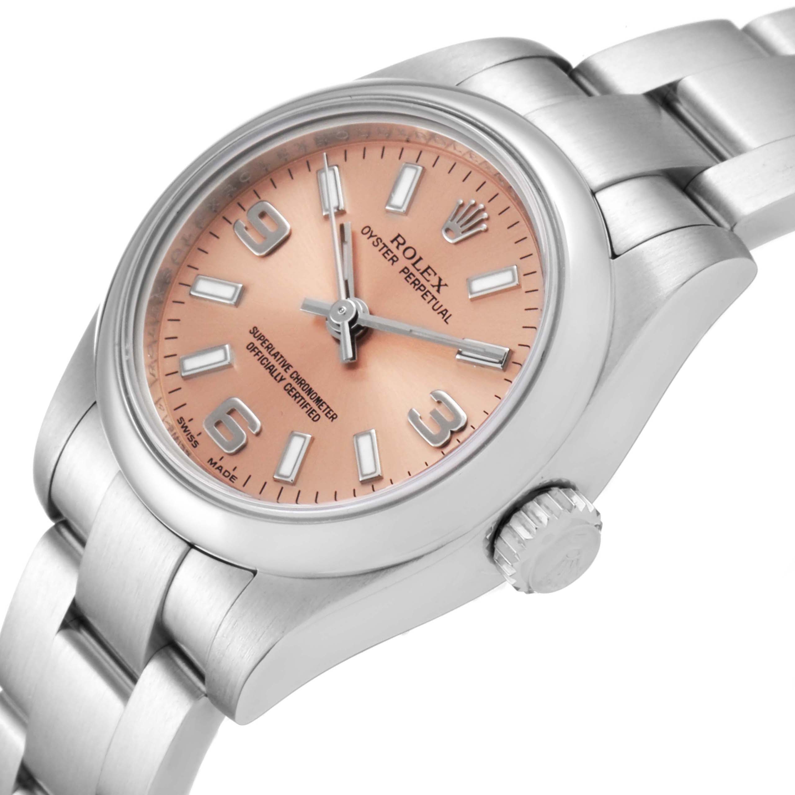 This image shows a Rolex Oyster Perpetual 176200 Women's Stainless Steel Pink Dial 176200 Women's Stainless Steel Pink Dial watch from an angled top-down view, highlighting the dial, crown, and bracelet.