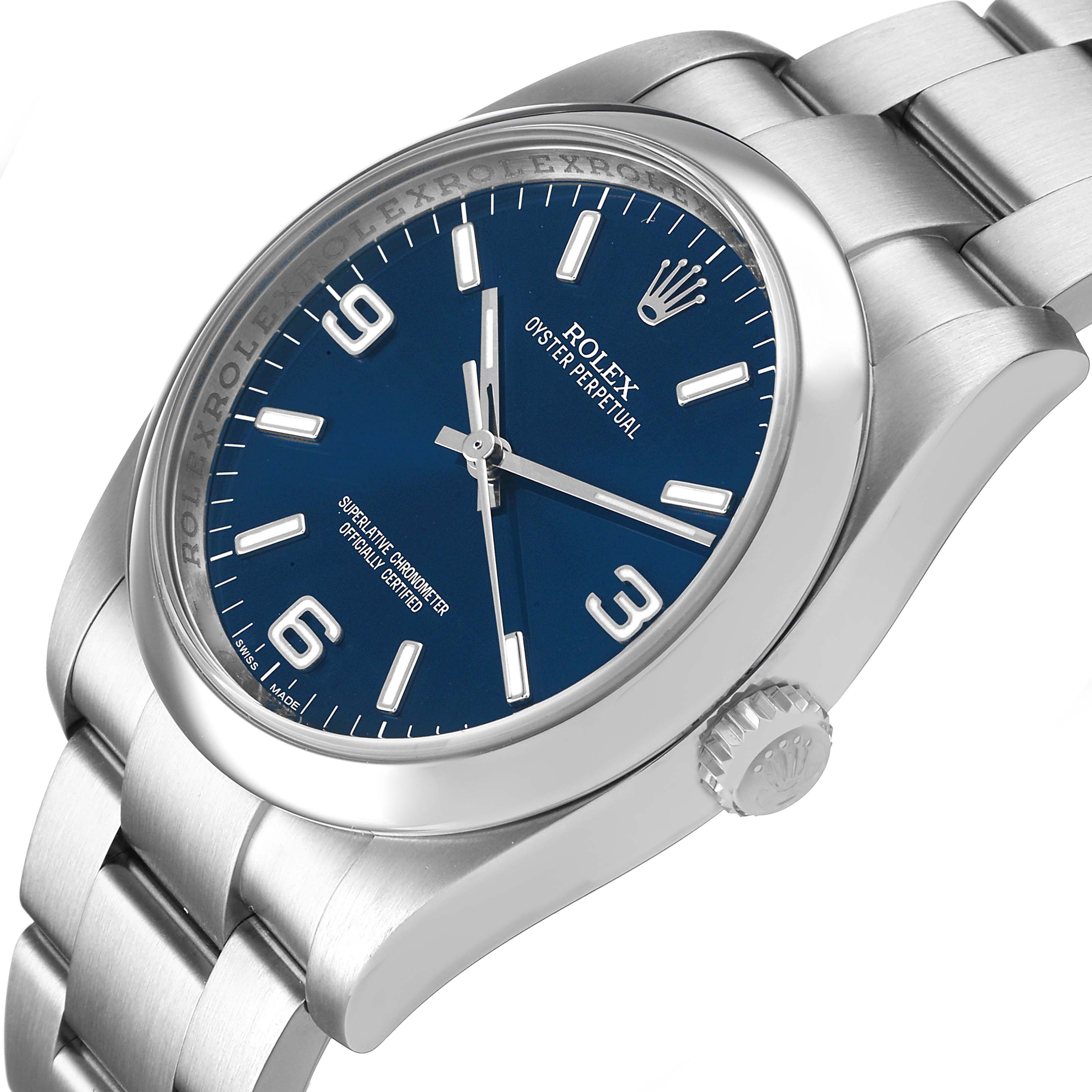The Rolex Oyster Perpetual 116000 Men's Stainless Steel Blue Dial watch is shown at a three-quarter angle, highlighting the blue dial, crown, and bracelet.
