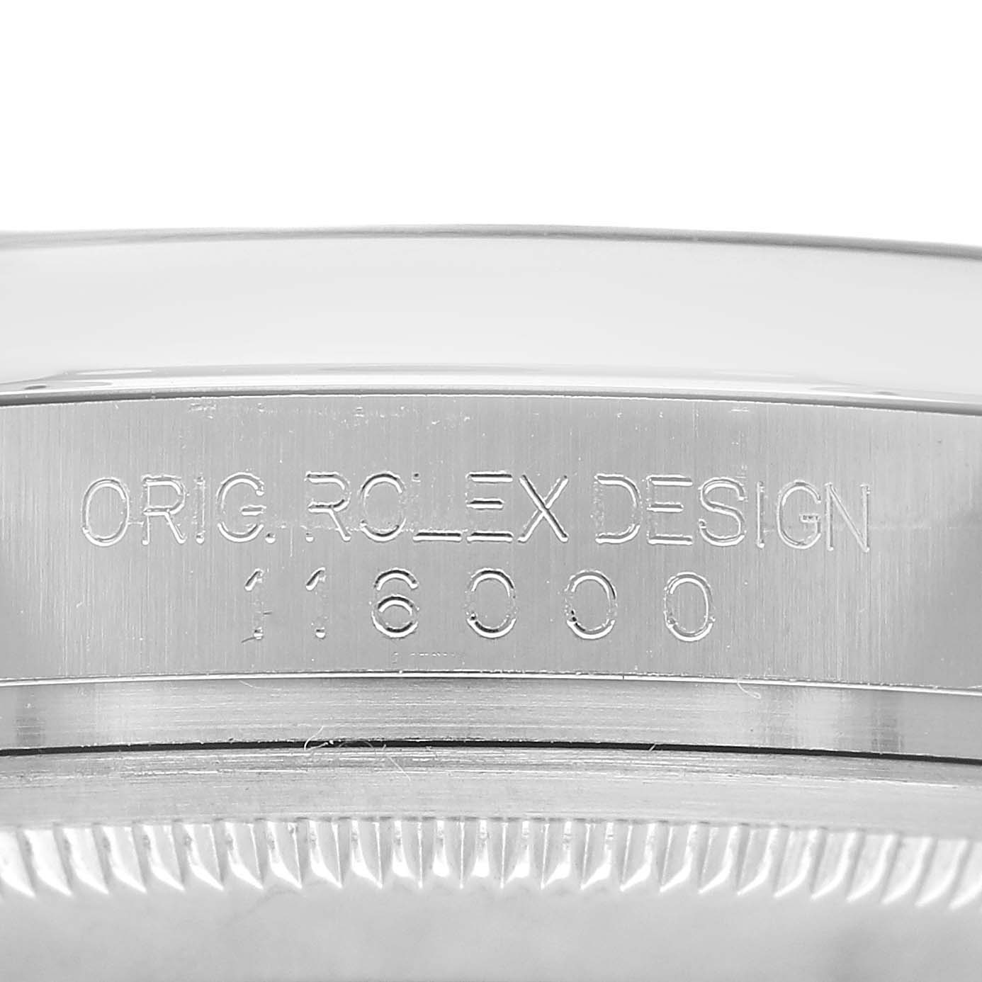 The image shows a close-up of the side case of a Rolex Oyster Perpetual 116000 Men's Stainless Steel Blue Dial, displaying the design engraving.