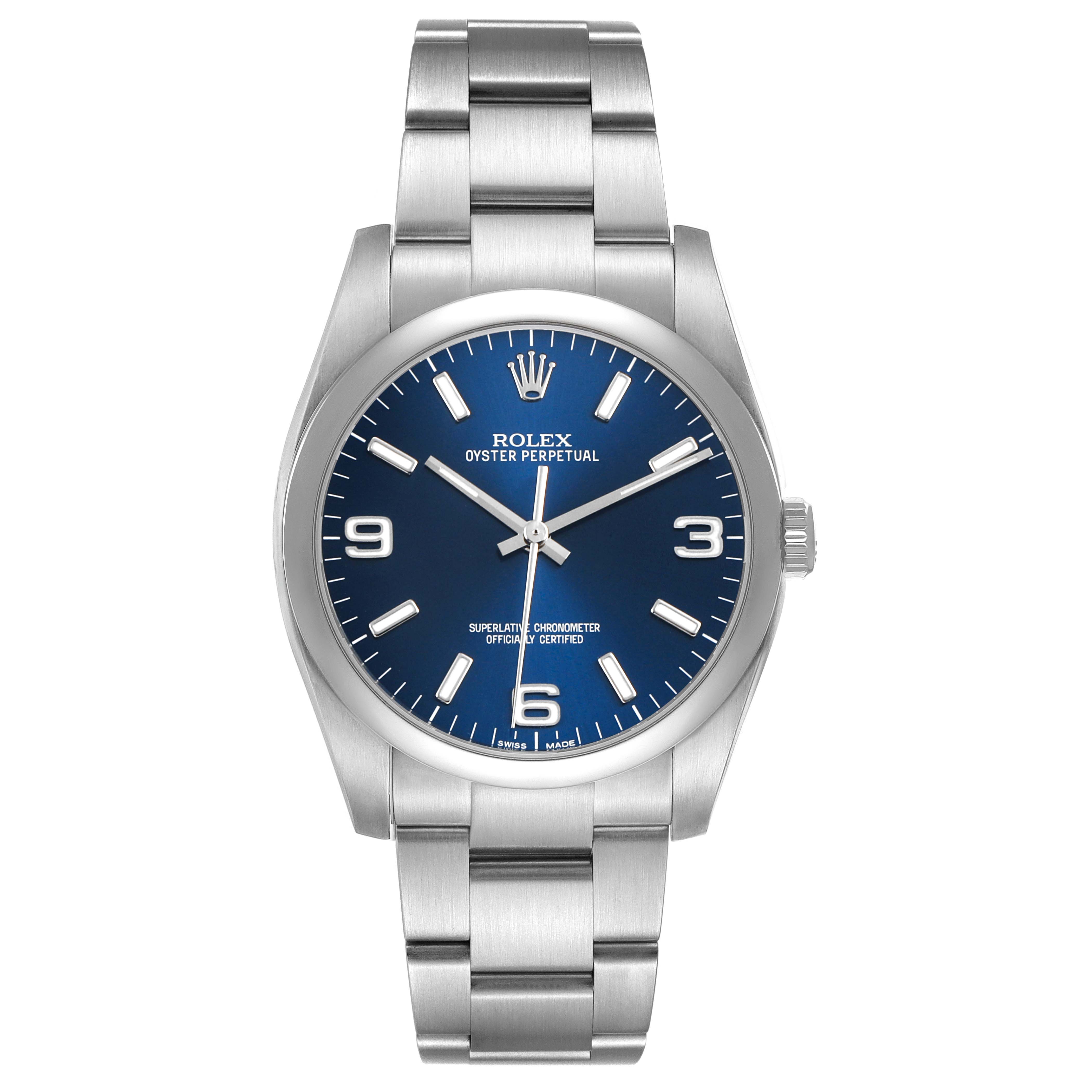 The Rolex Oyster Perpetual 116000 Men's Stainless Steel Blue Dial watch is shown from a front view, displaying the blue dial, hour markers, bezel, and stainless steel bracelet.