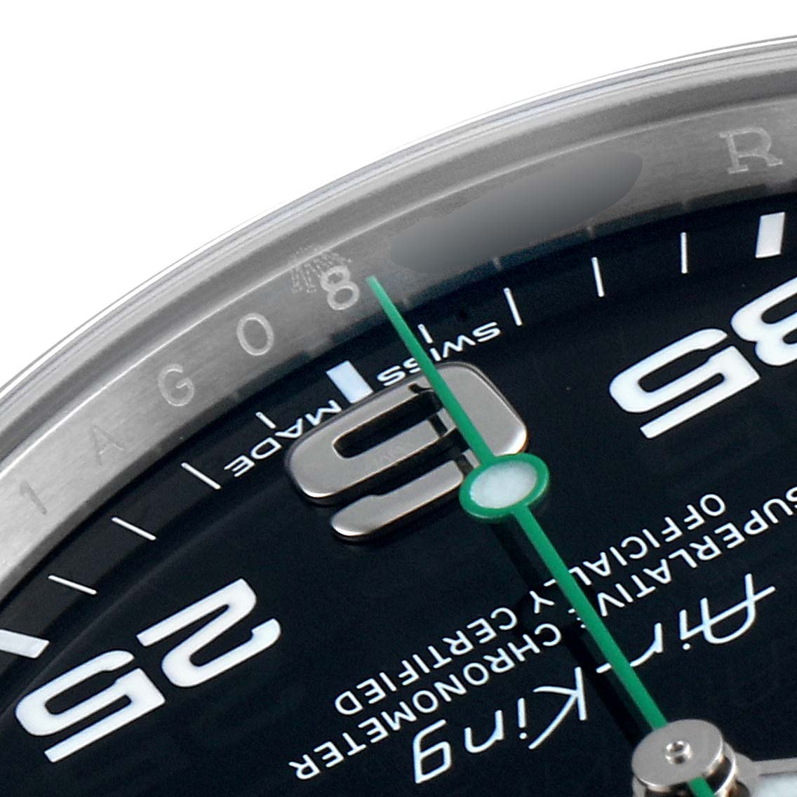 This image shows a close-up of the dial and bezel detail of a Rolex Air-King 116900 Men's Stainless Steel Black Dial 116900 Men's Stainless Steel Black Dial watch, highlighting the numbers 6, 25, and a green second hand.