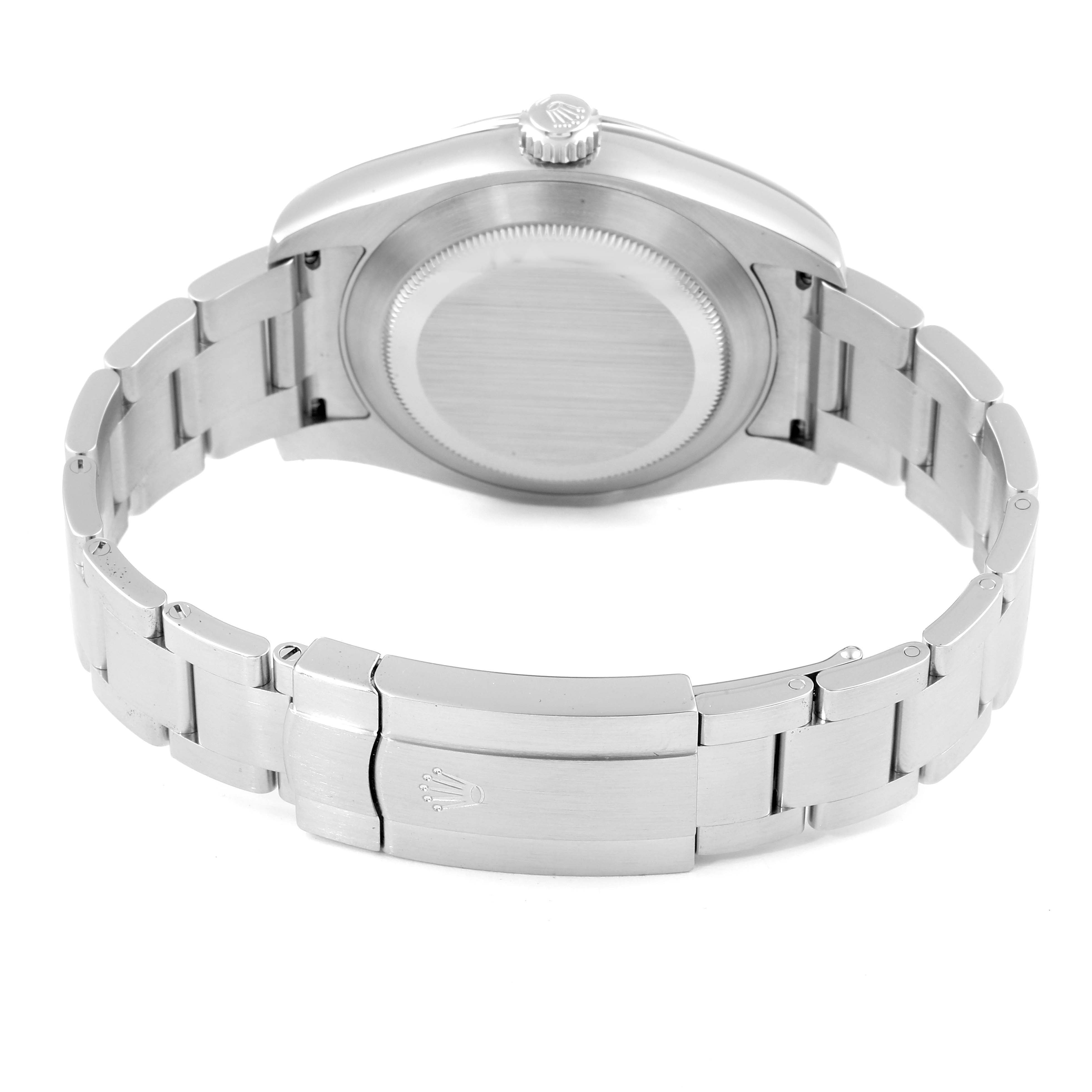 The Rolex Air-King 116900 Men's Stainless Steel Black Dial 116900 Men's Stainless Steel Black Dial watch is shown from the back, highlighting the closed clasp, bracelet, case back, and crown.