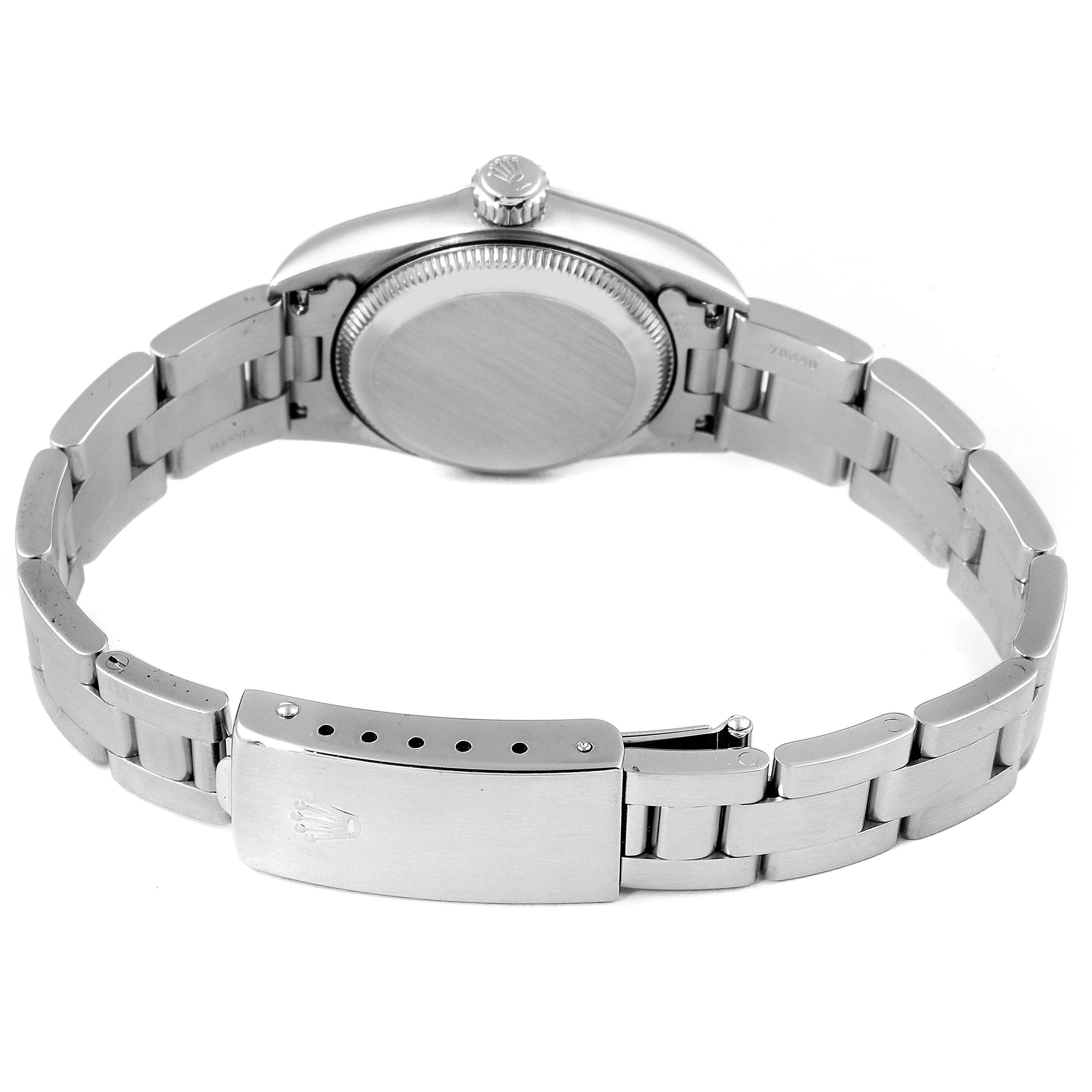 The image shows the back view of the Rolex Oyster Perpetual 67180 Women
s Stainless Steel Blue Dial 67180 Women
s Stainless Steel Blue Dial watch, highlighting its case back, crown, and bracelet clasp.