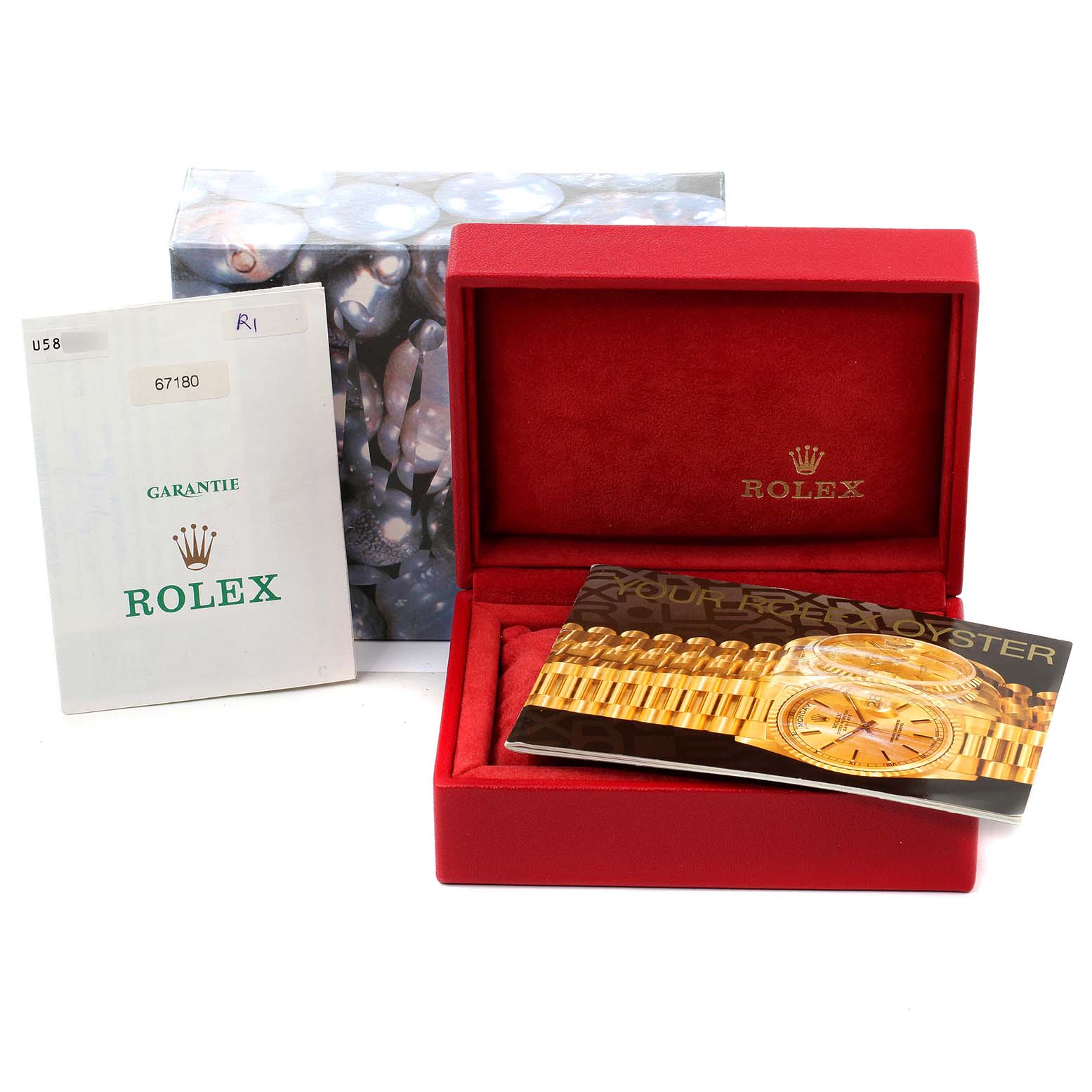 The image shows a Rolex Oyster Perpetual 67180 Women's Stainless Steel White Dial 67180 Women's Stainless Steel White Dial watch box, warranty booklet, and a brochure, all from a top-down angle.