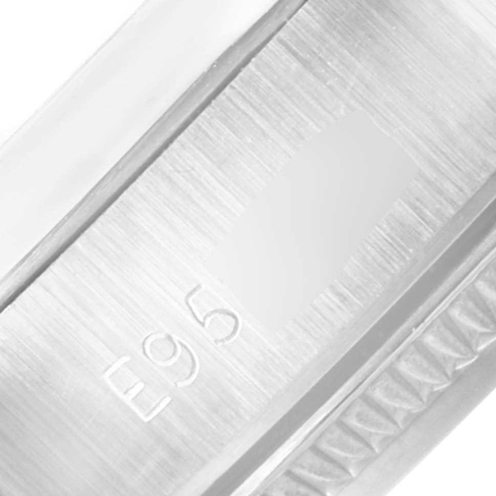 This is a close-up image of the inner clasp of a Rolex Oyster Perpetual 67180 Women's Stainless Steel Black Dial 67180 Women's Stainless Steel Black Dial watch, showing the engraved serial number.