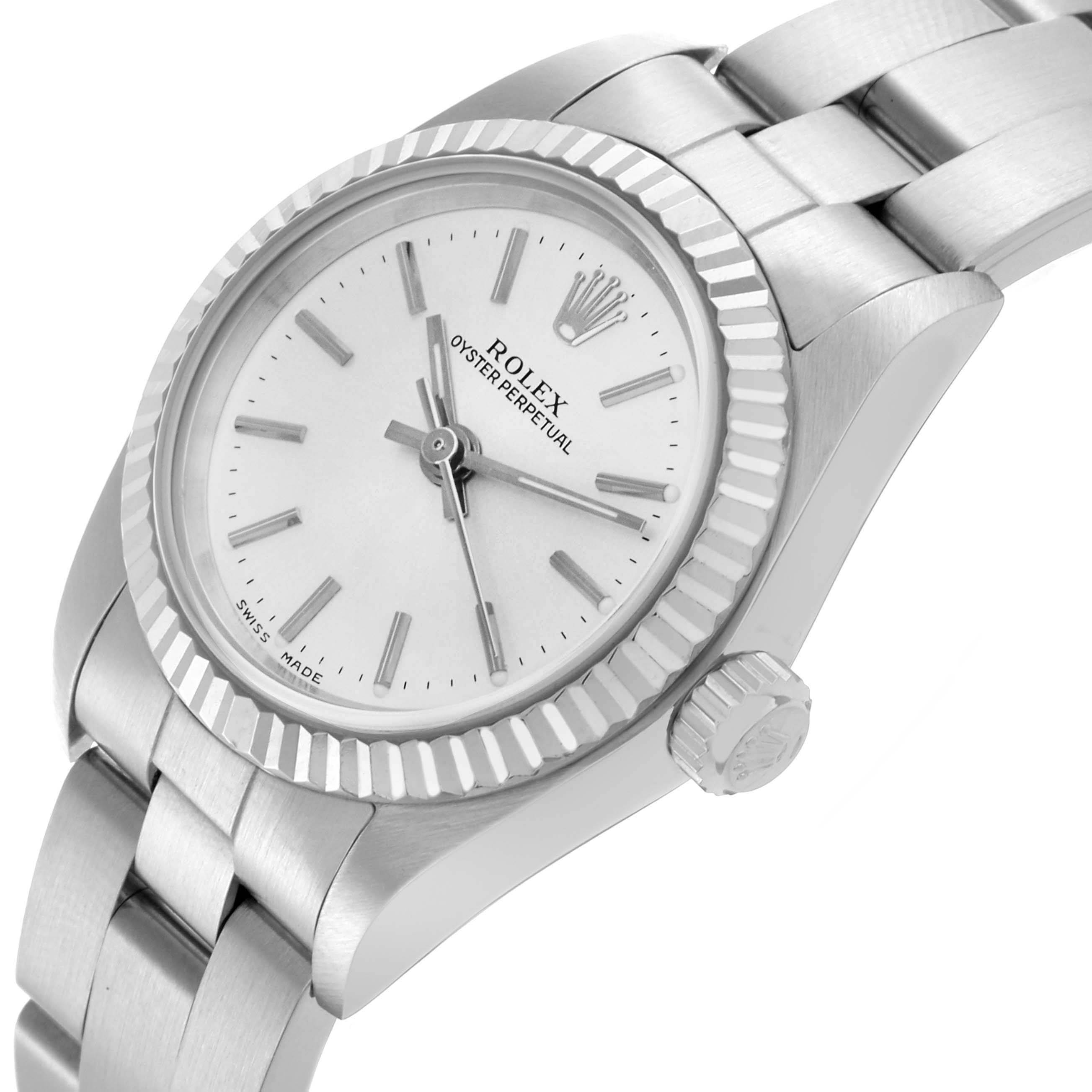 The Rolex Oyster Perpetual 76094 Women's Stainless Steel Silver Dial 76094 Women's Stainless Steel Silver Dial watch is shown at an angled view displaying the face, bezel, crown, and part of the bracelet.