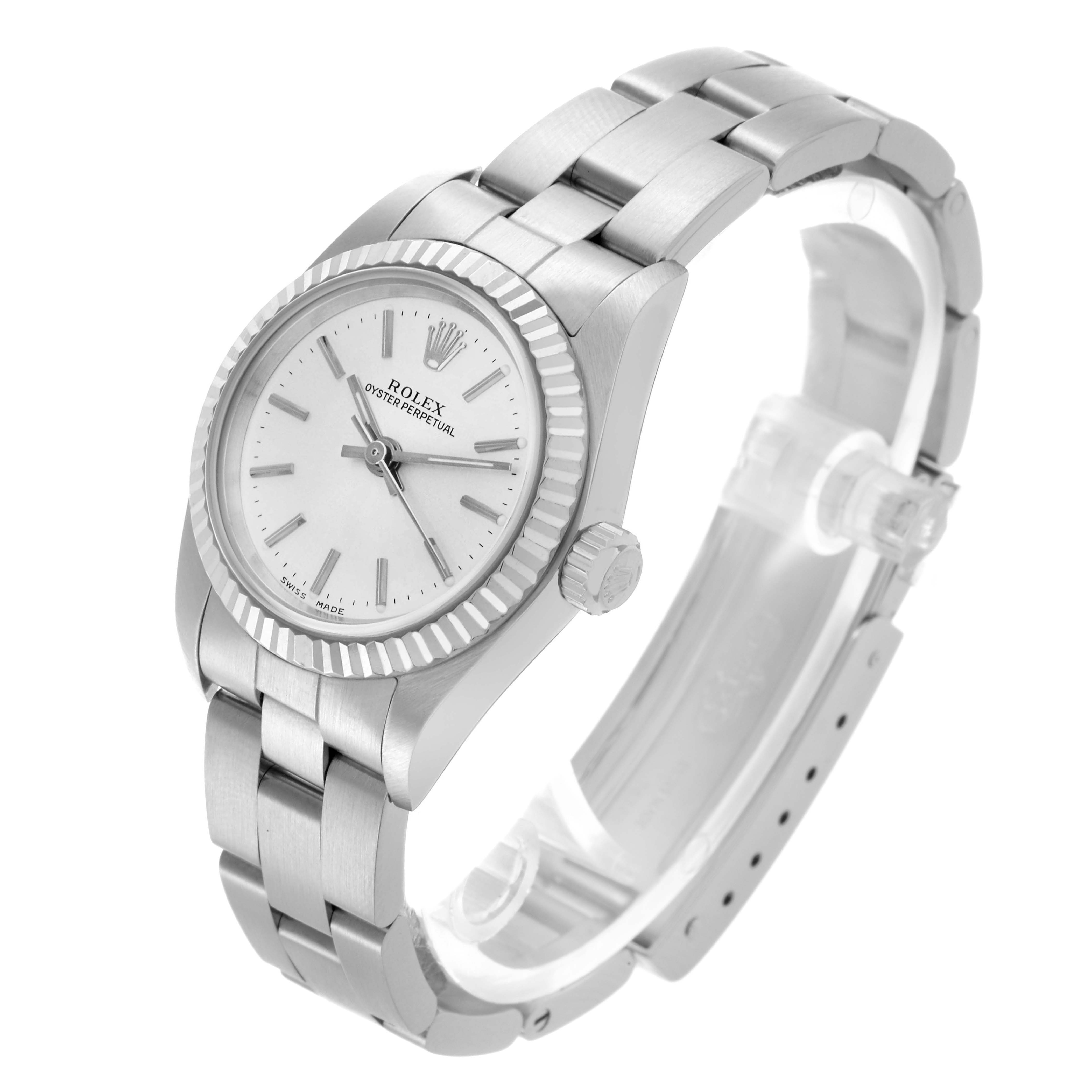 The Rolex Oyster Perpetual 76094 Women's Stainless Steel Silver Dial 76094 Women's Stainless Steel Silver Dial watch is shown at a three-quarter angle, highlighting the face, bezel, crown, and bracelet.